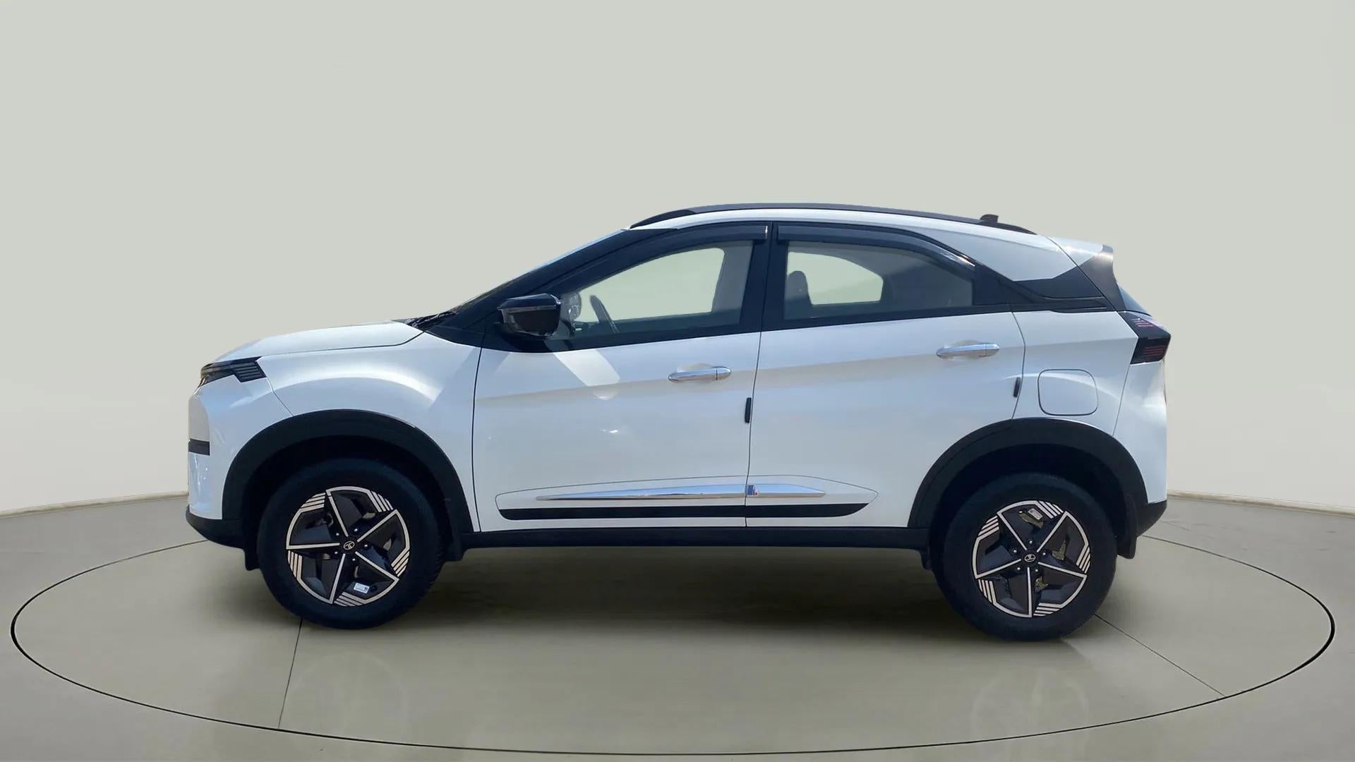 Side view of a Calgary White Tata Nexon