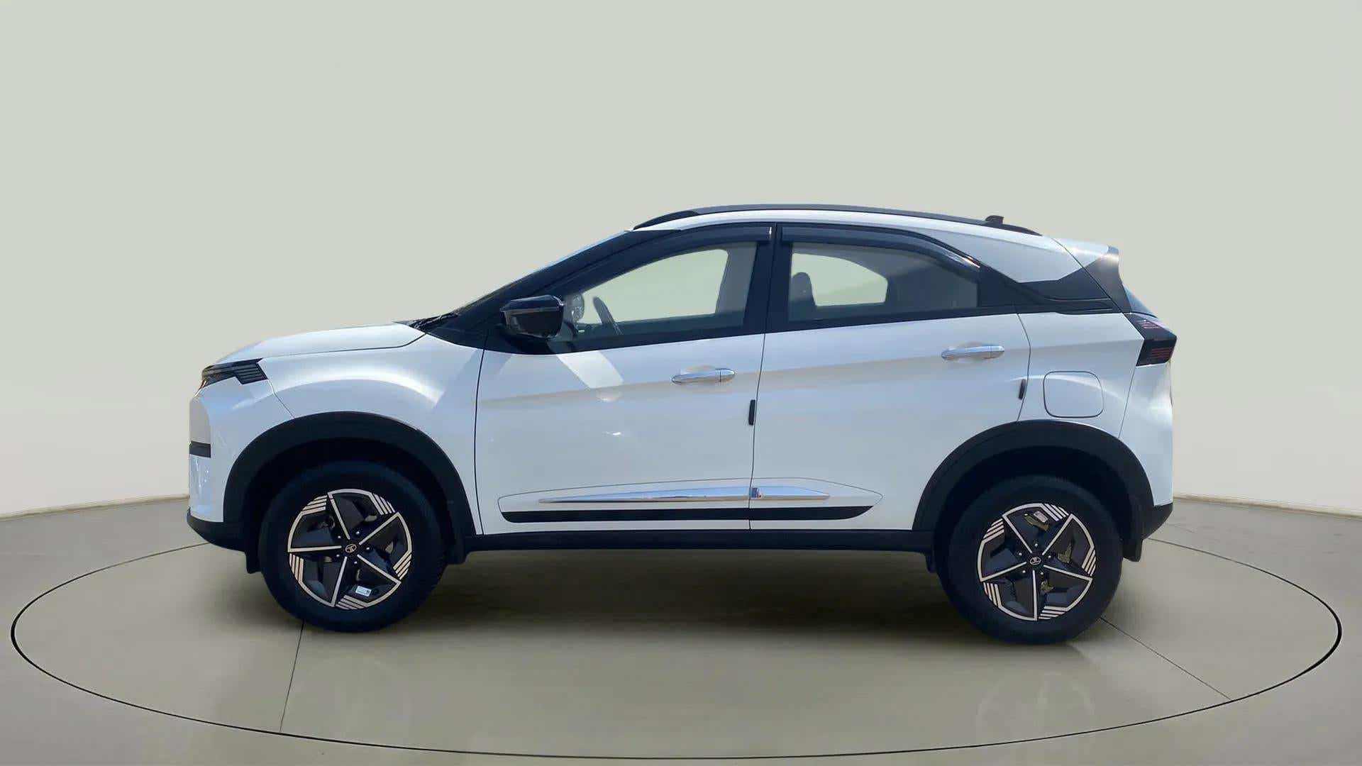 Side view of a Calgary White Tata Nexon