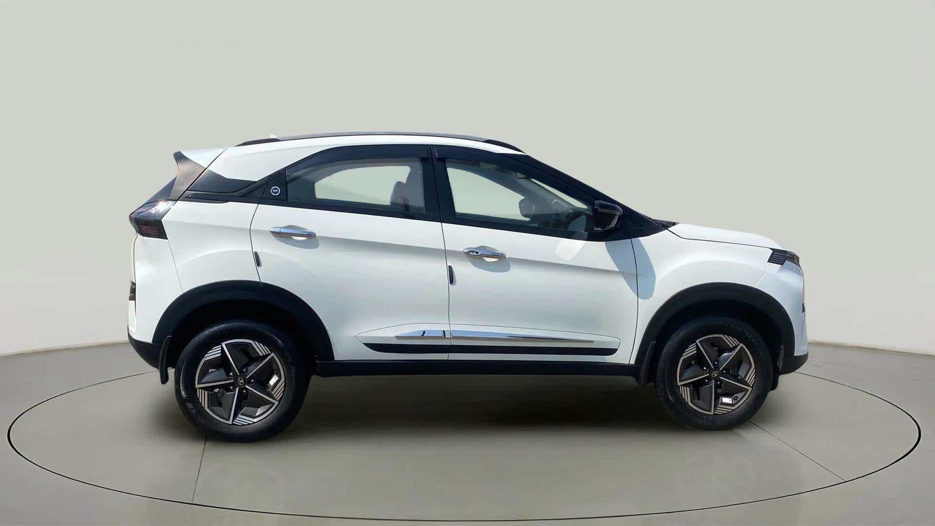Side view of a Calgary White Tata Nexon