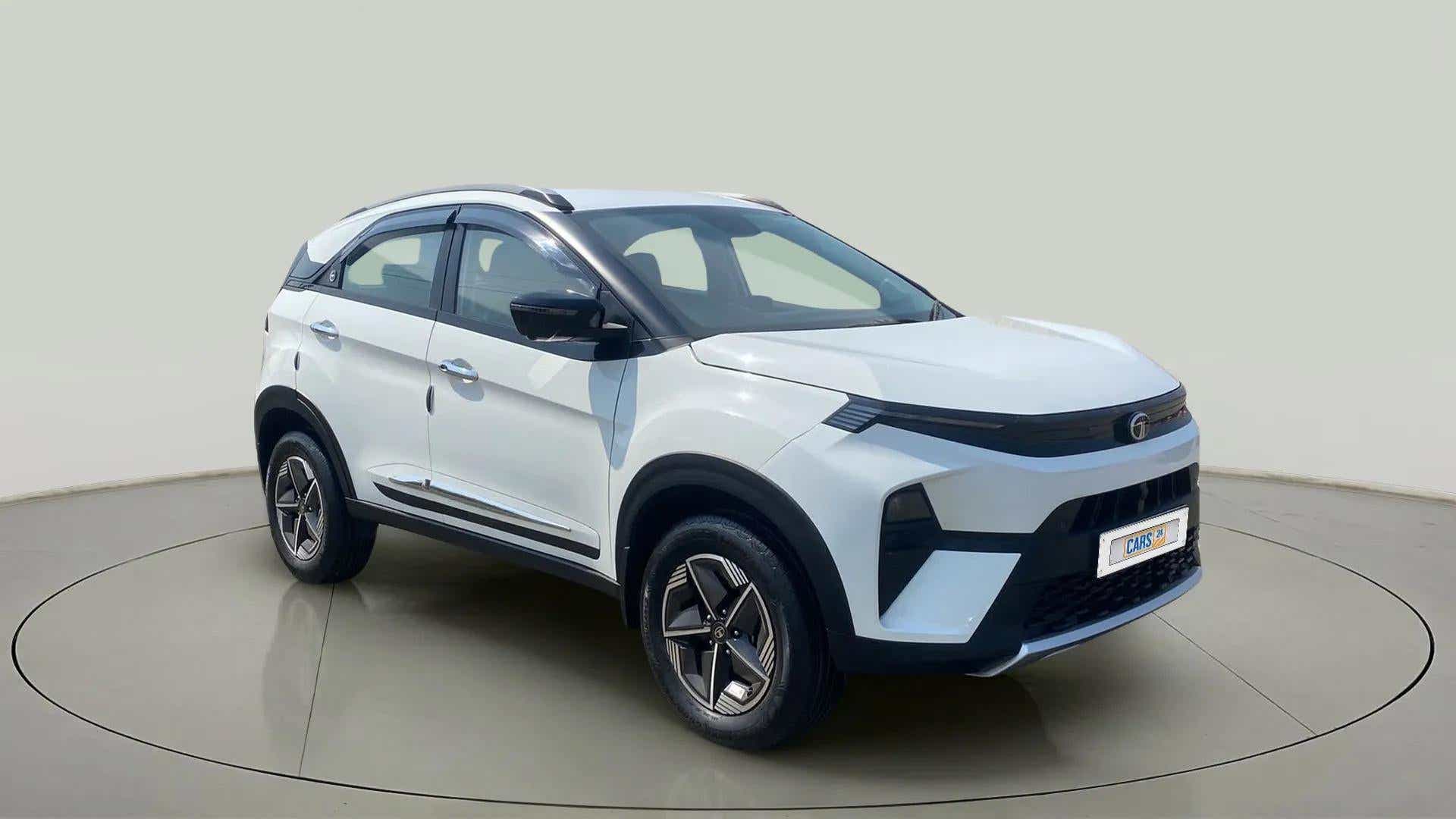 Front three-quarter view of a Calgary White Tata Nexon