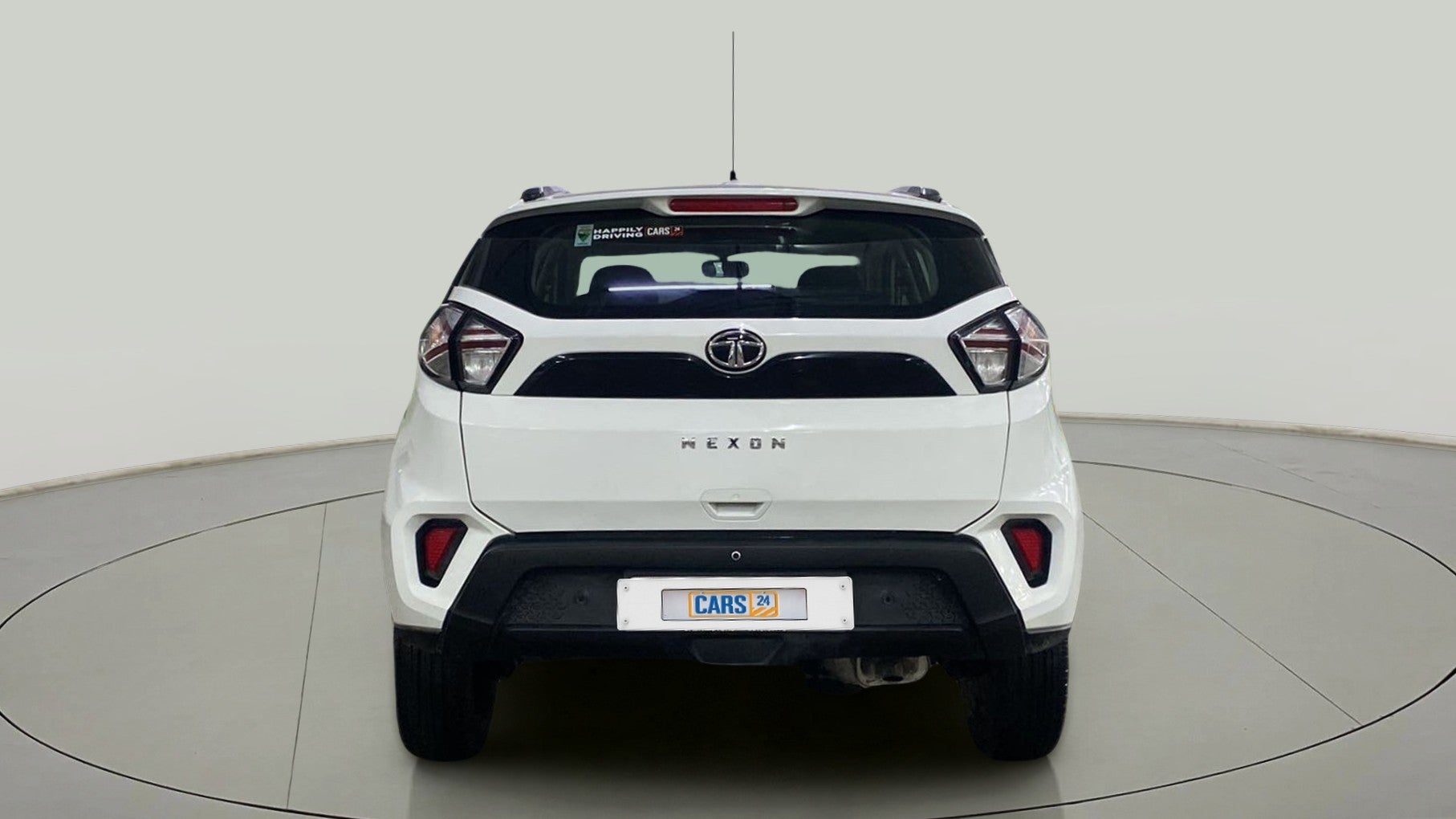 Rear view of a calgary-white Tata Nexon 2017-2023