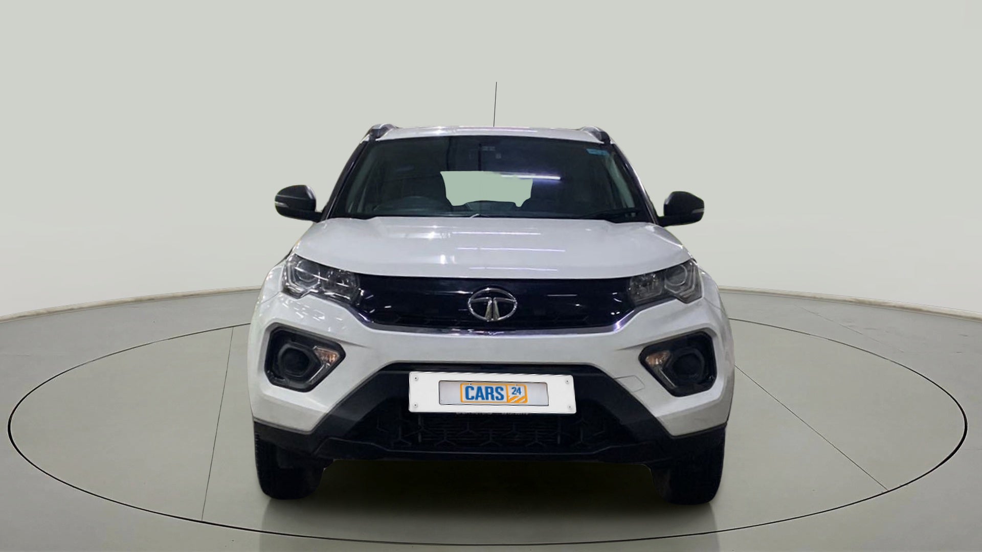 Front view of a calgary-white Tata Nexon 2017-2023