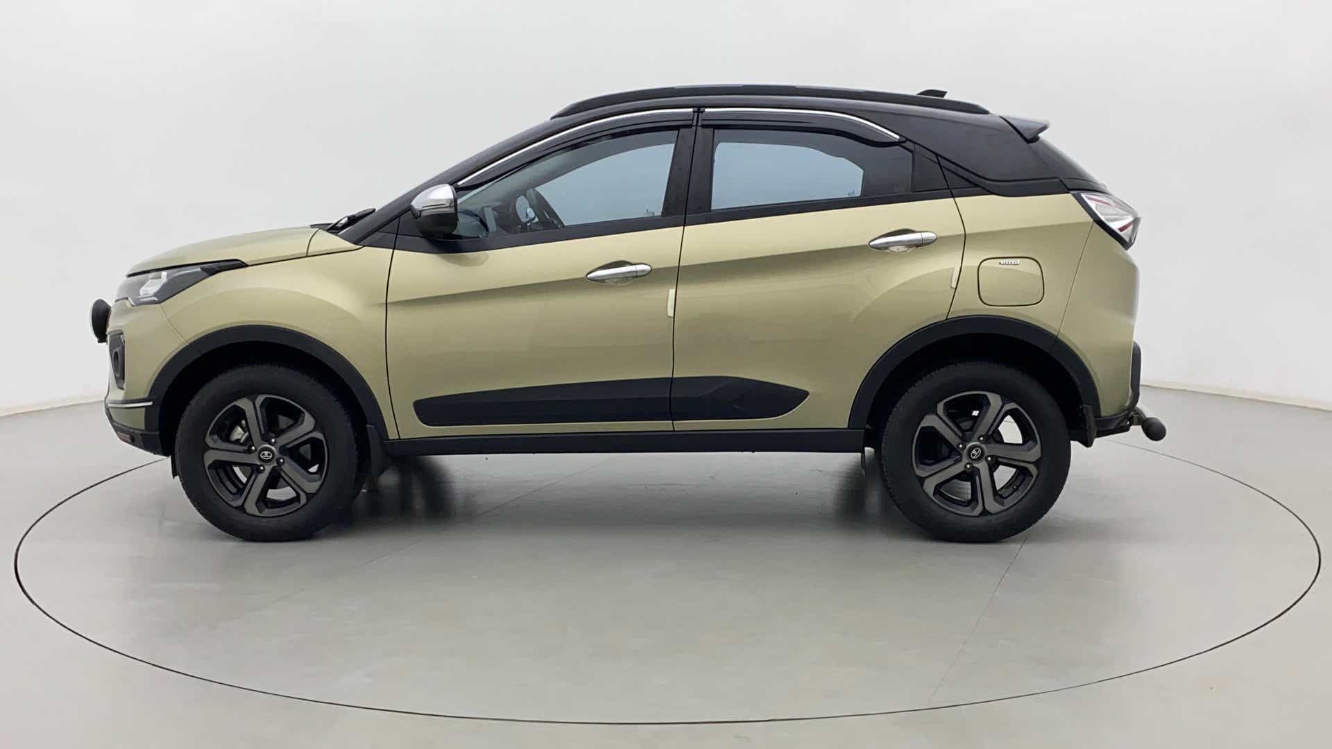 Side view of a Grassland Beige Tata Nexon 2017-2023