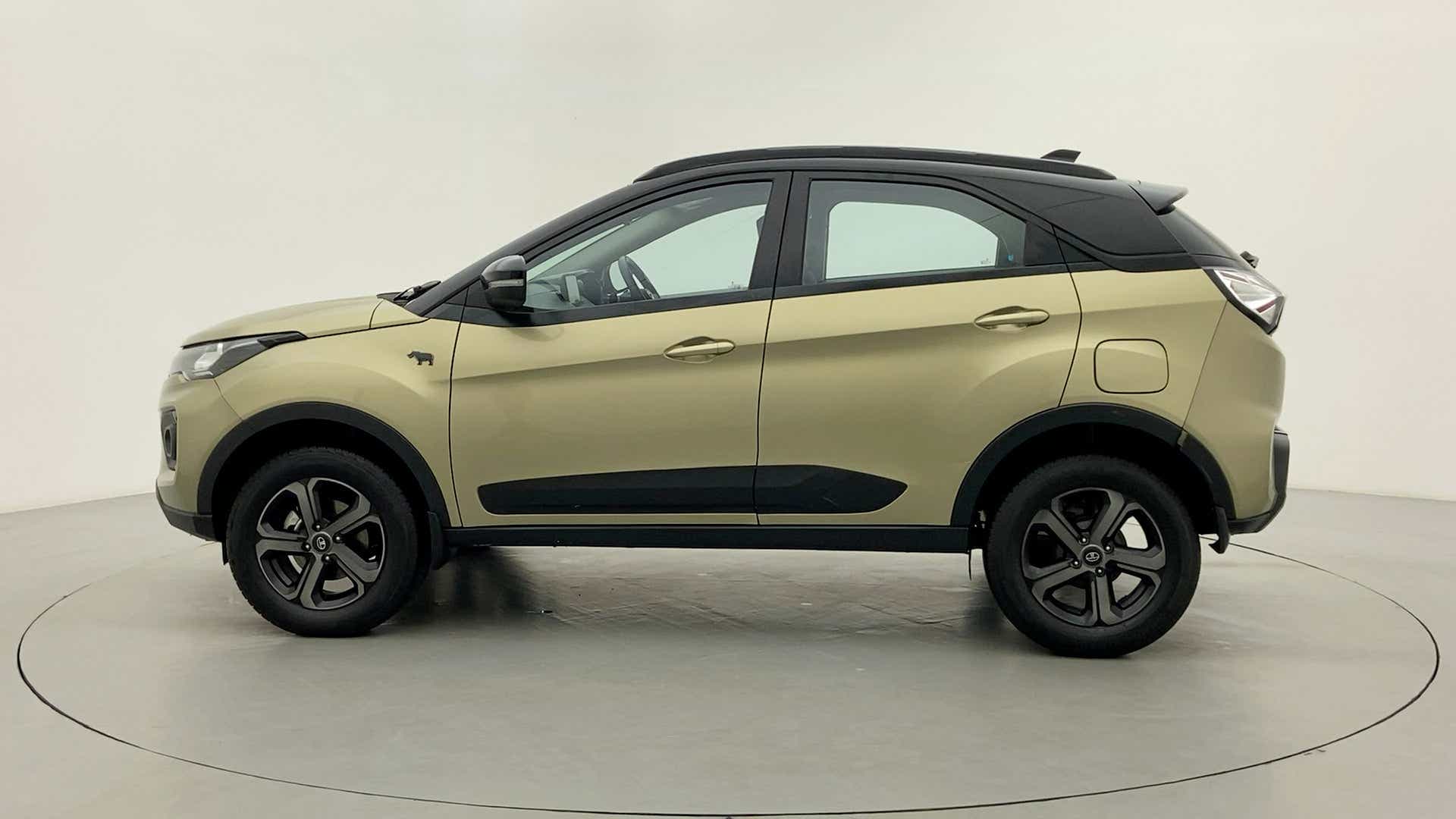 Side view of a Grassland Beige Tata Nexon 2017-2023