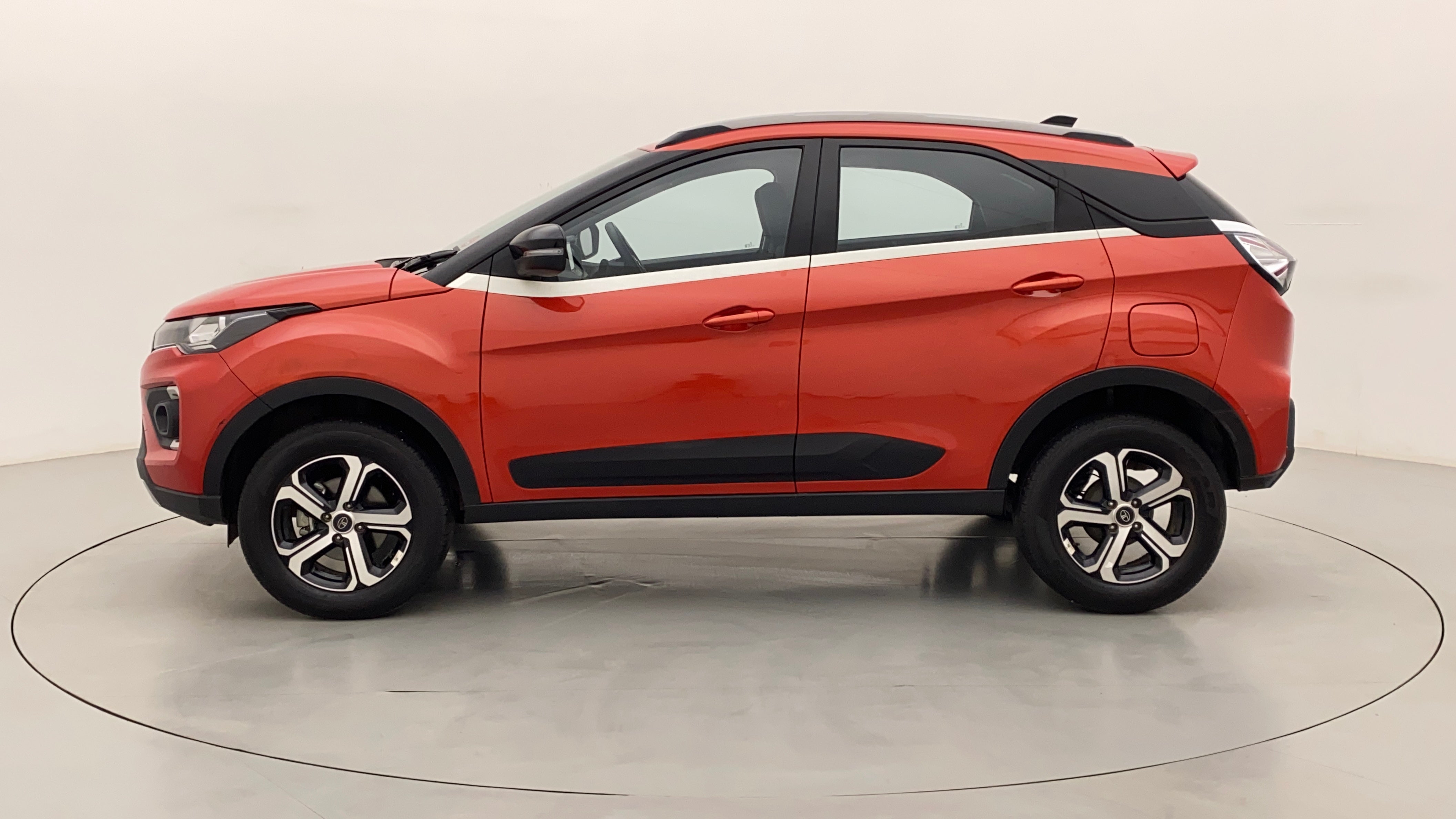 Side view of a Flame Red Tata Nexon 2017-2023