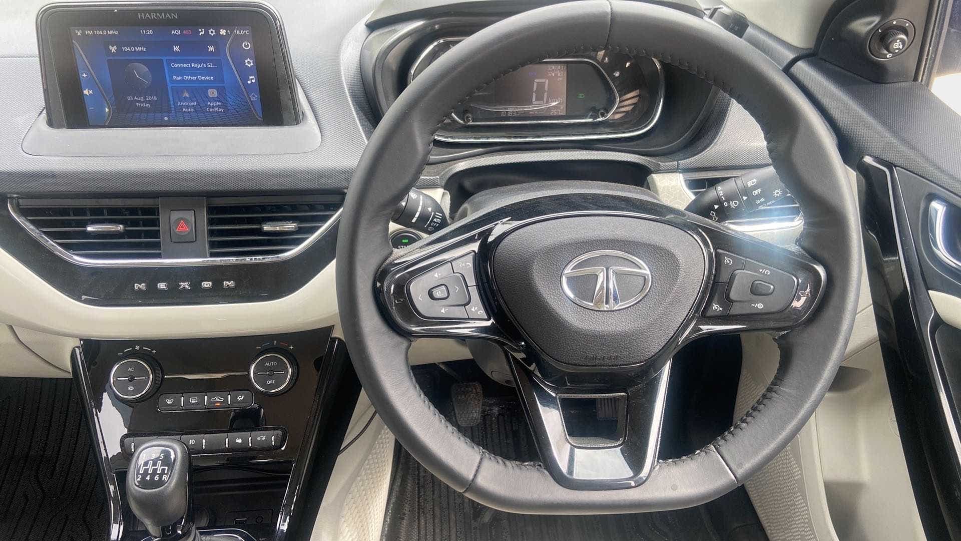 Interior dashboard and steering wheel of a Tata Nexon 2017-2023