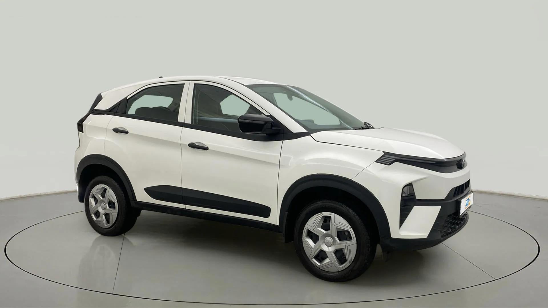 Side view of a Calgary White Tata Nexon
