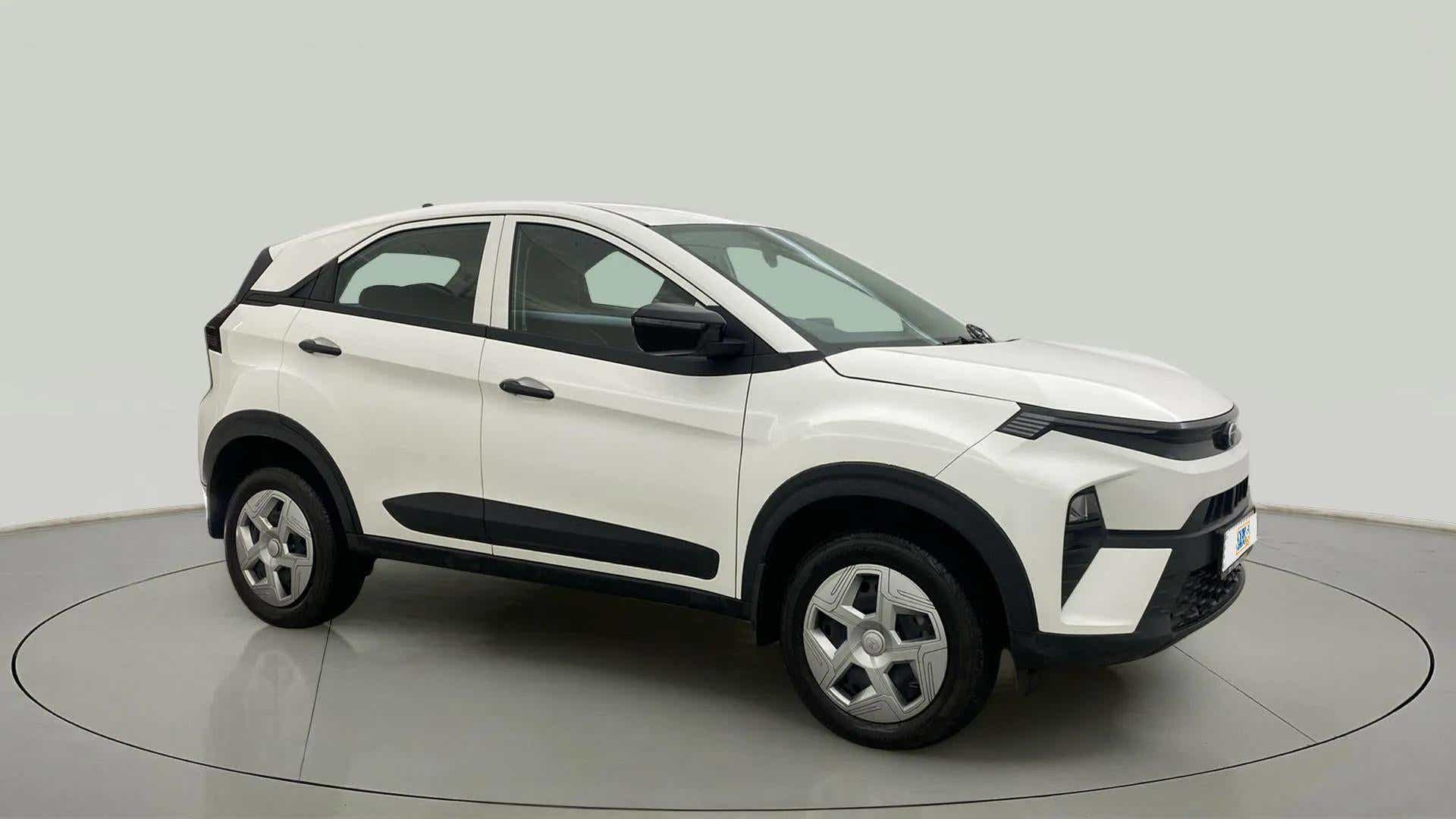 Side view of a Calgary White Tata Nexon