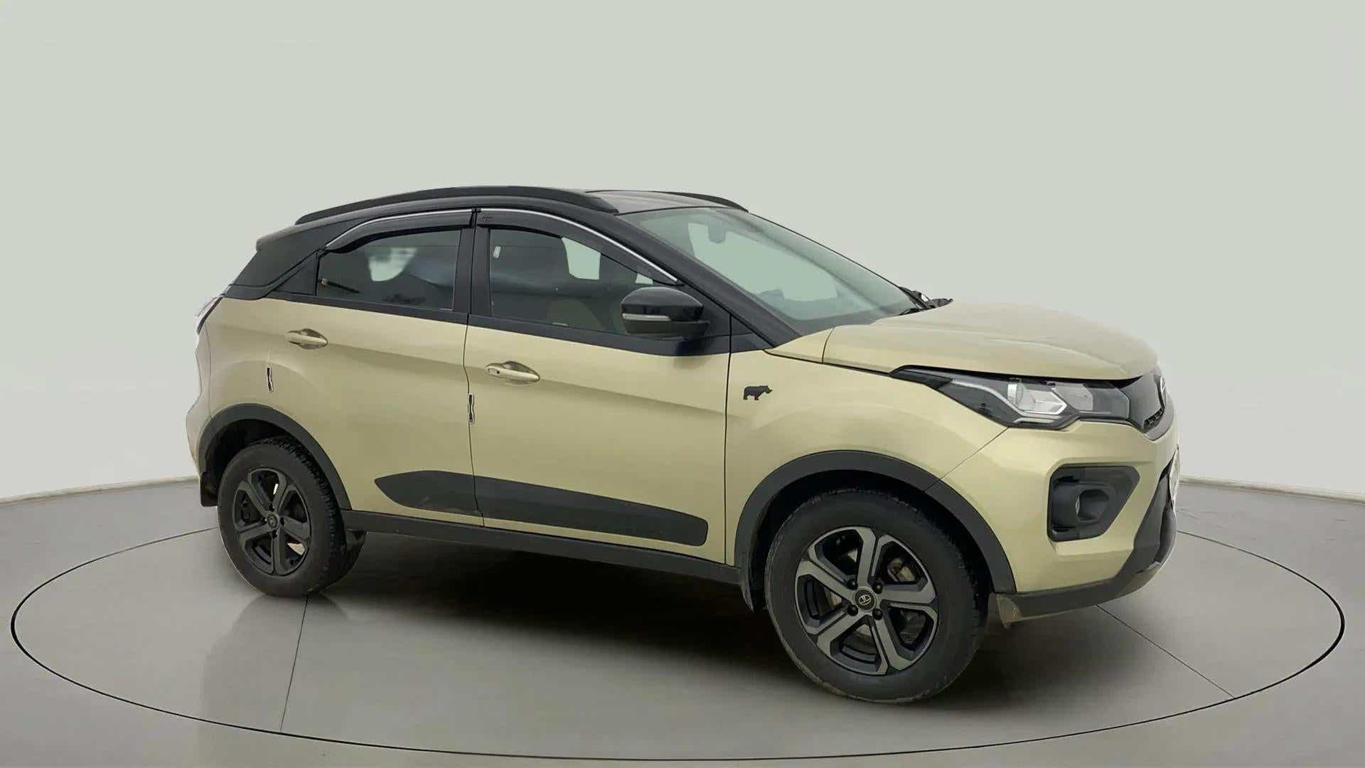 Side view of a Grassland Beige Tata Nexon 2017-2023