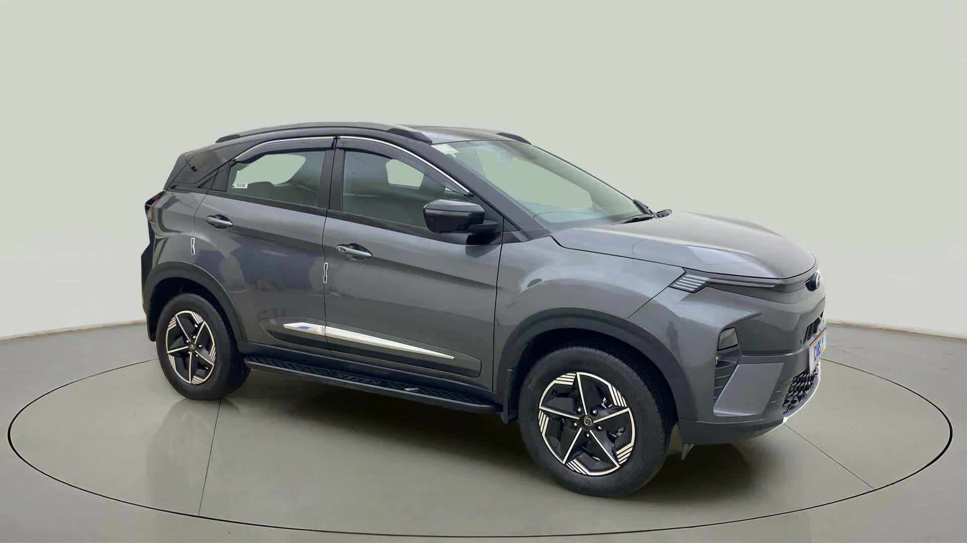 Front three-quarter view of a pure-grey Tata Nexon