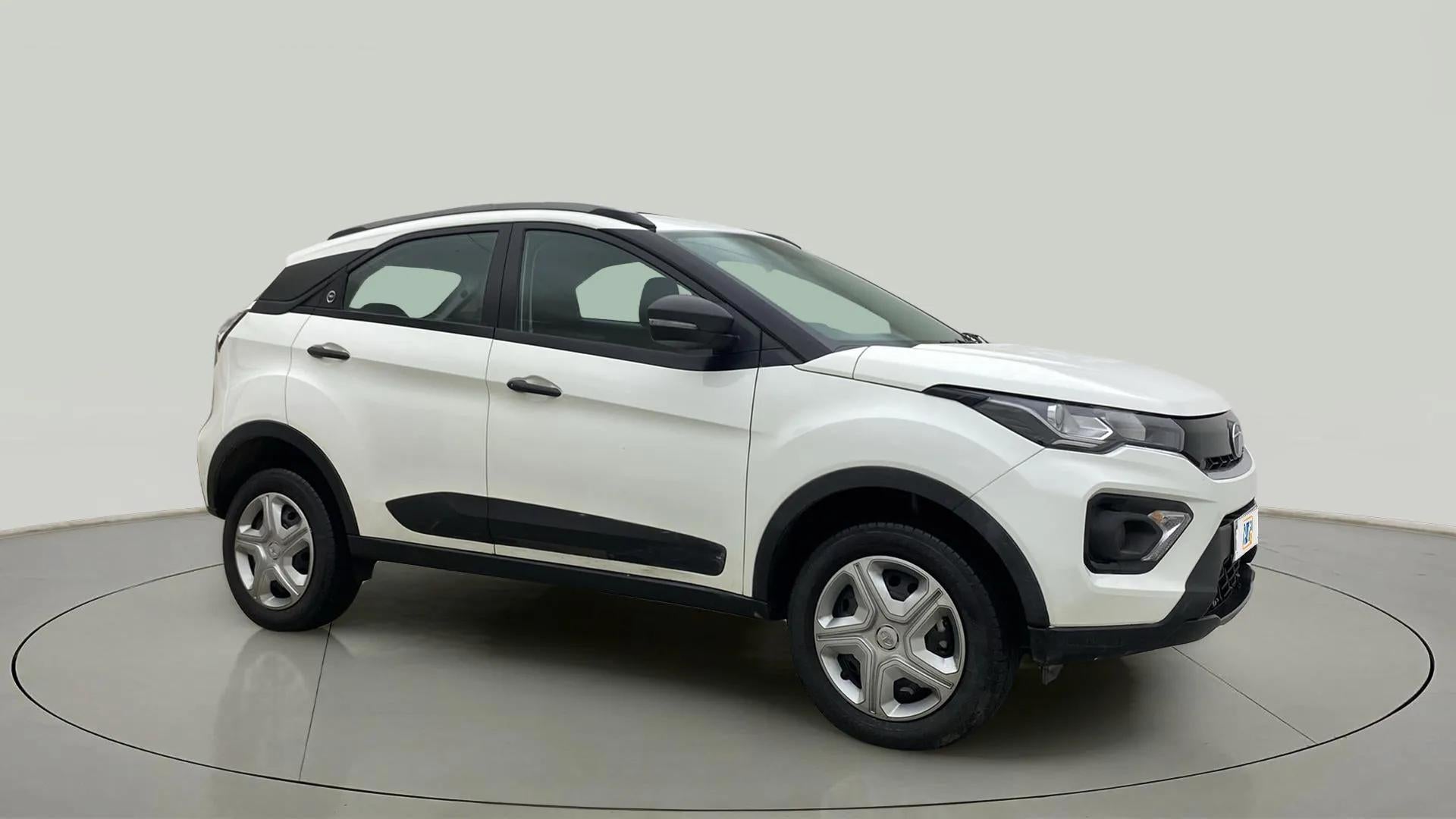 Front-side view of a calgary-white Tata Nexon 2017-2023