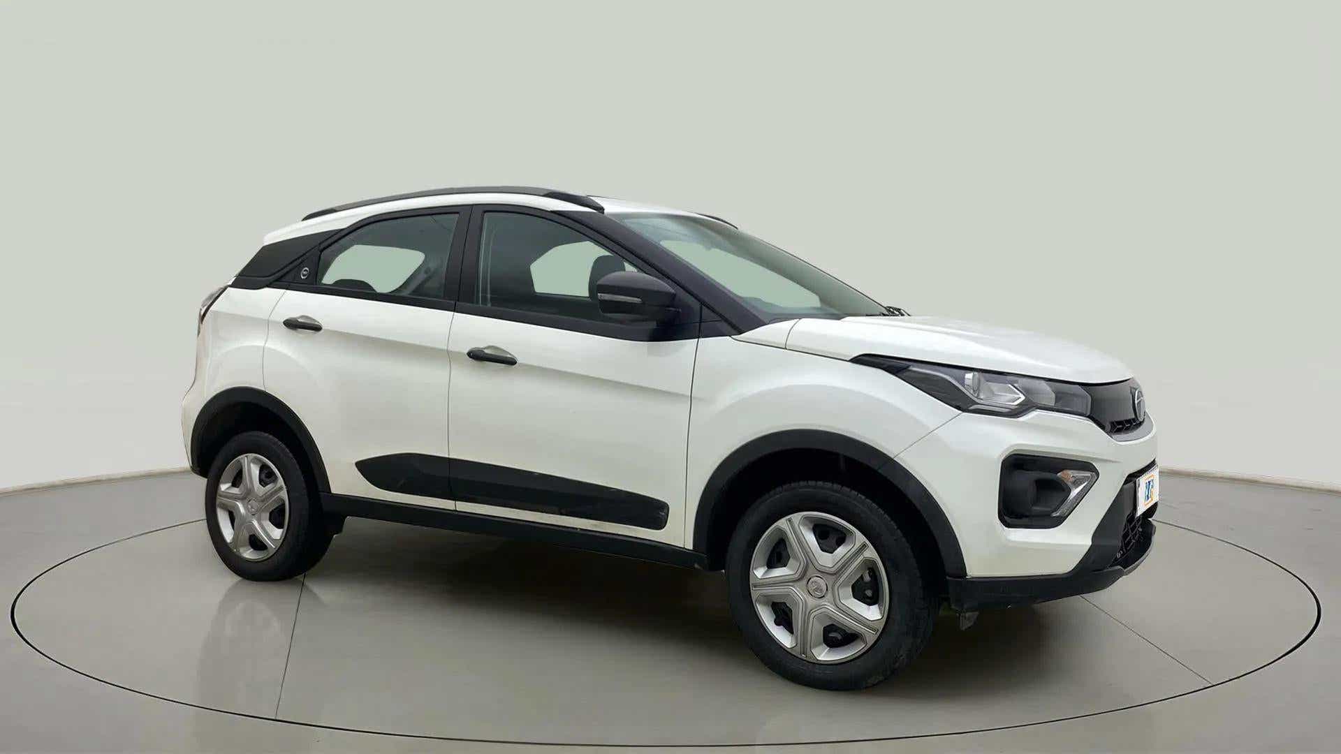 Front-side view of a calgary-white Tata Nexon 2017-2023