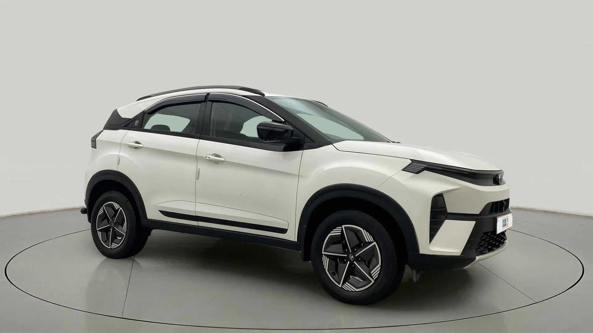 Front side view of a Calgary White Tata Nexon 2017-2023