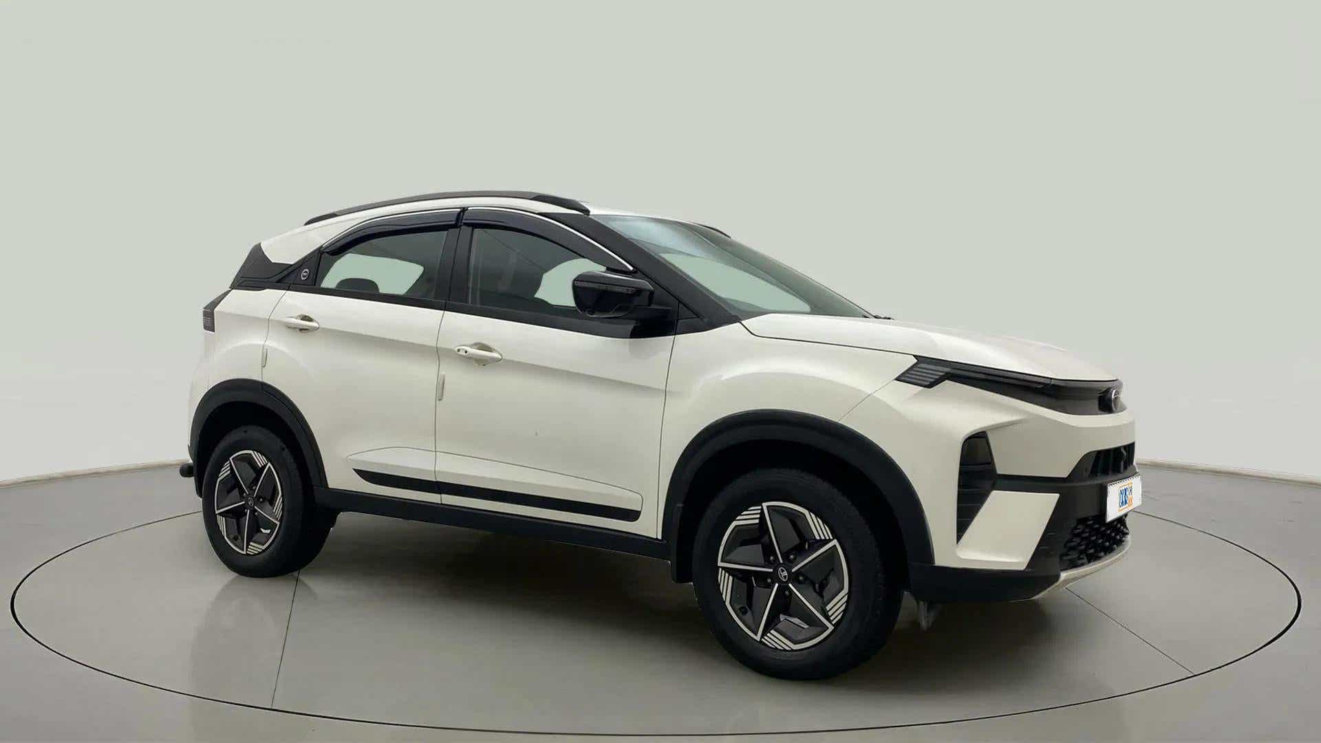 Front side view of a Calgary White Tata Nexon 2017-2023