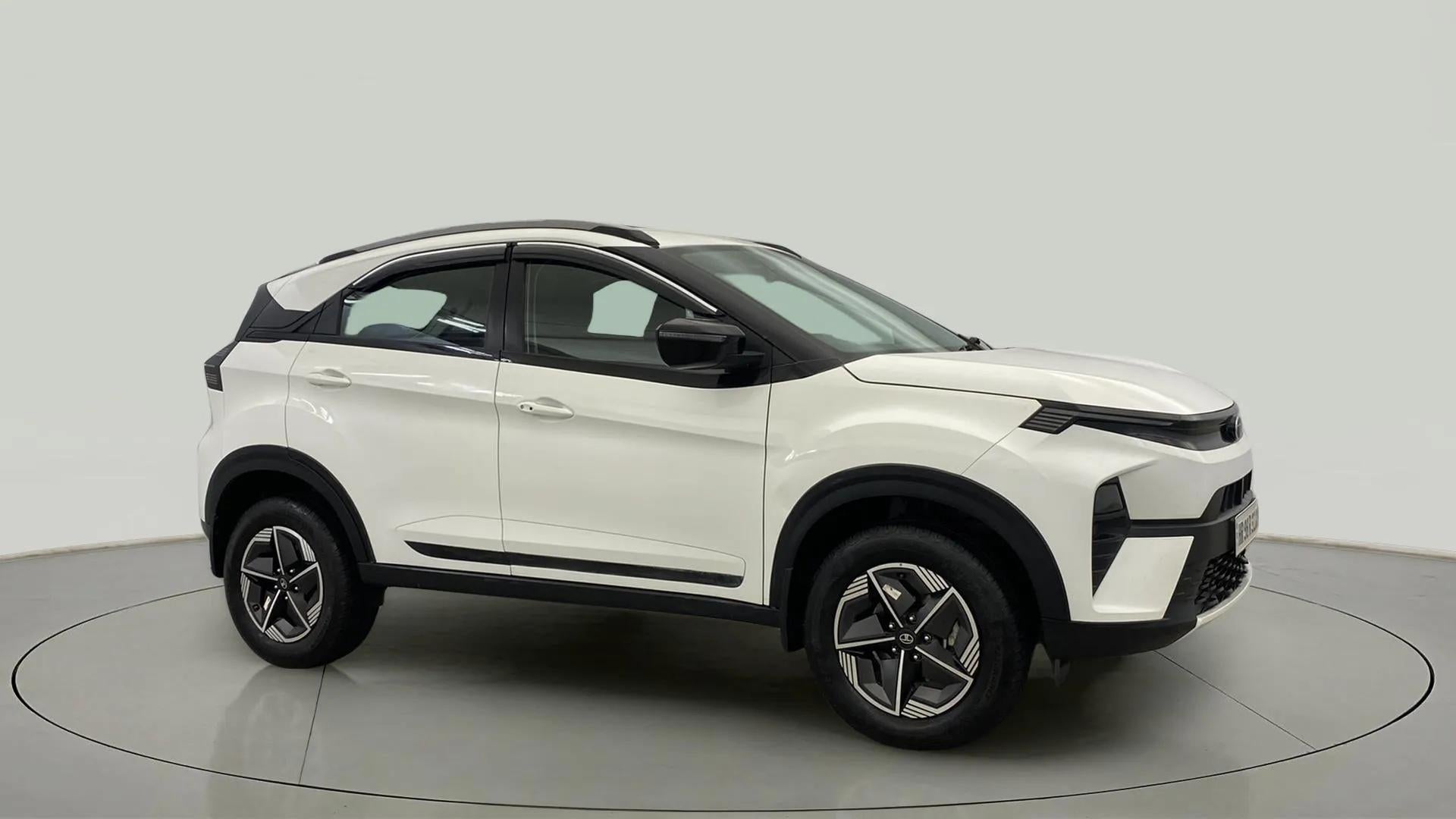 Side view of a Calgary White Tata Nexon