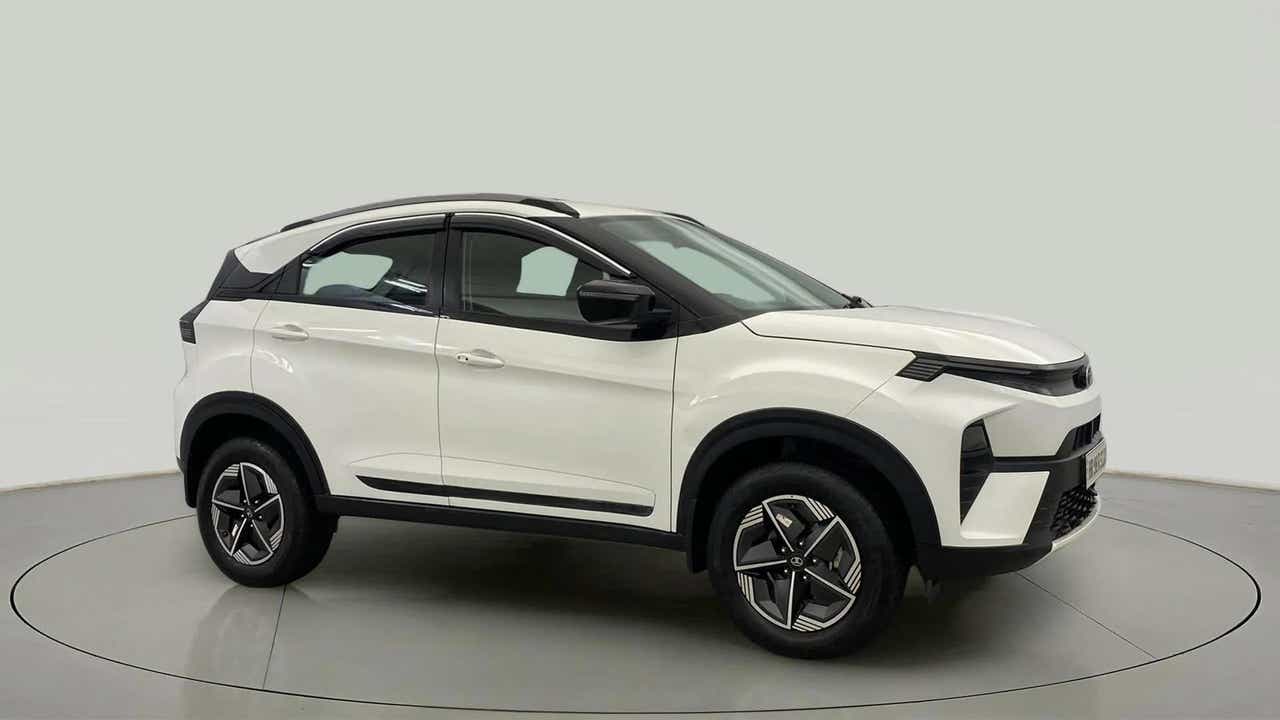Side view of a Calgary White Tata Nexon