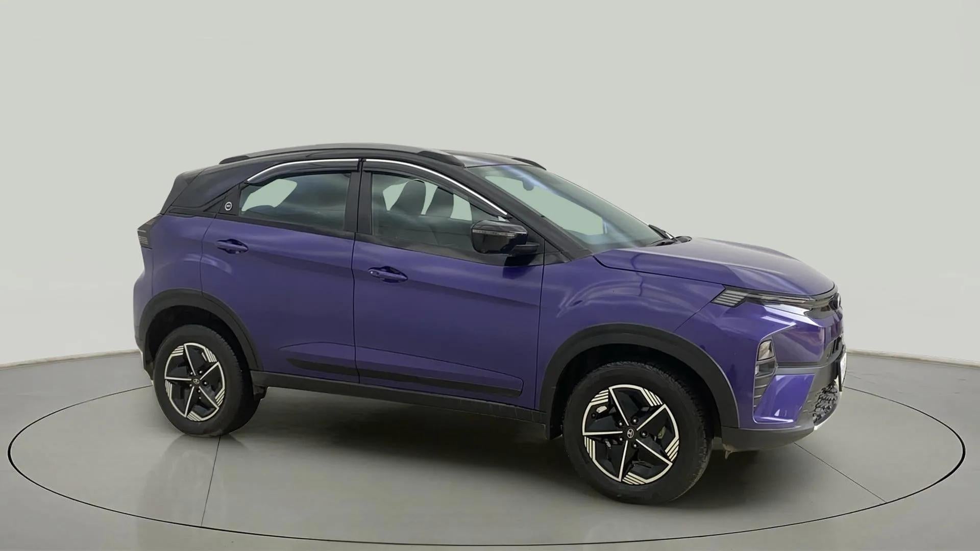 Side view of a royal blue Tata Nexon