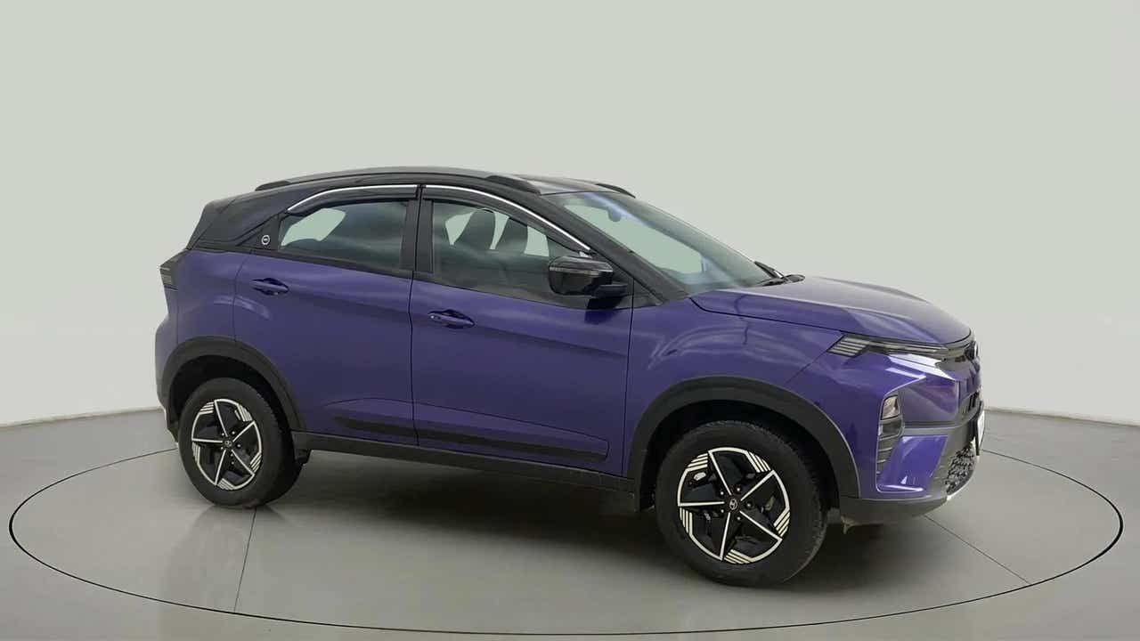 Side view of a royal blue Tata Nexon