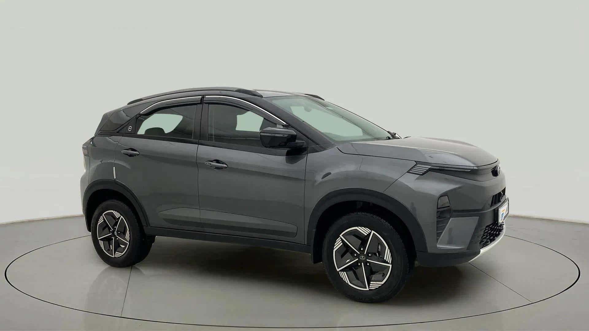 Side view of a daytona grey Tata Nexon
