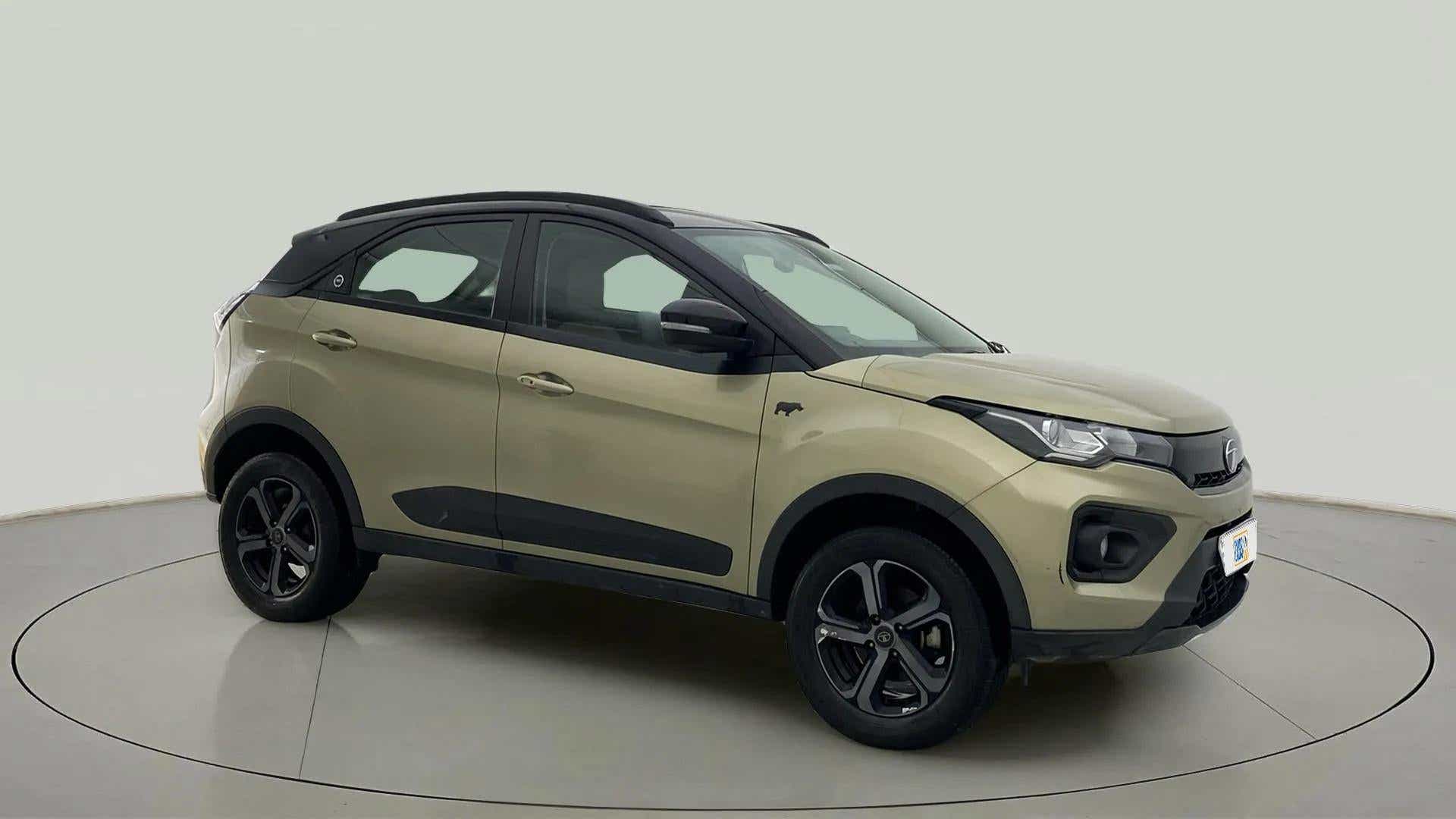 Side view of a Grassland Beige Tata Nexon 2017-2023