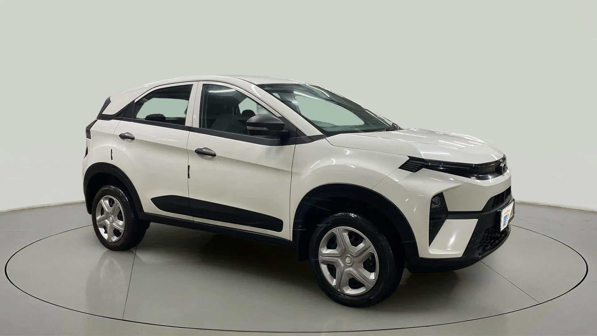 Front three-quarter view of a Calgary White Tata Nexon