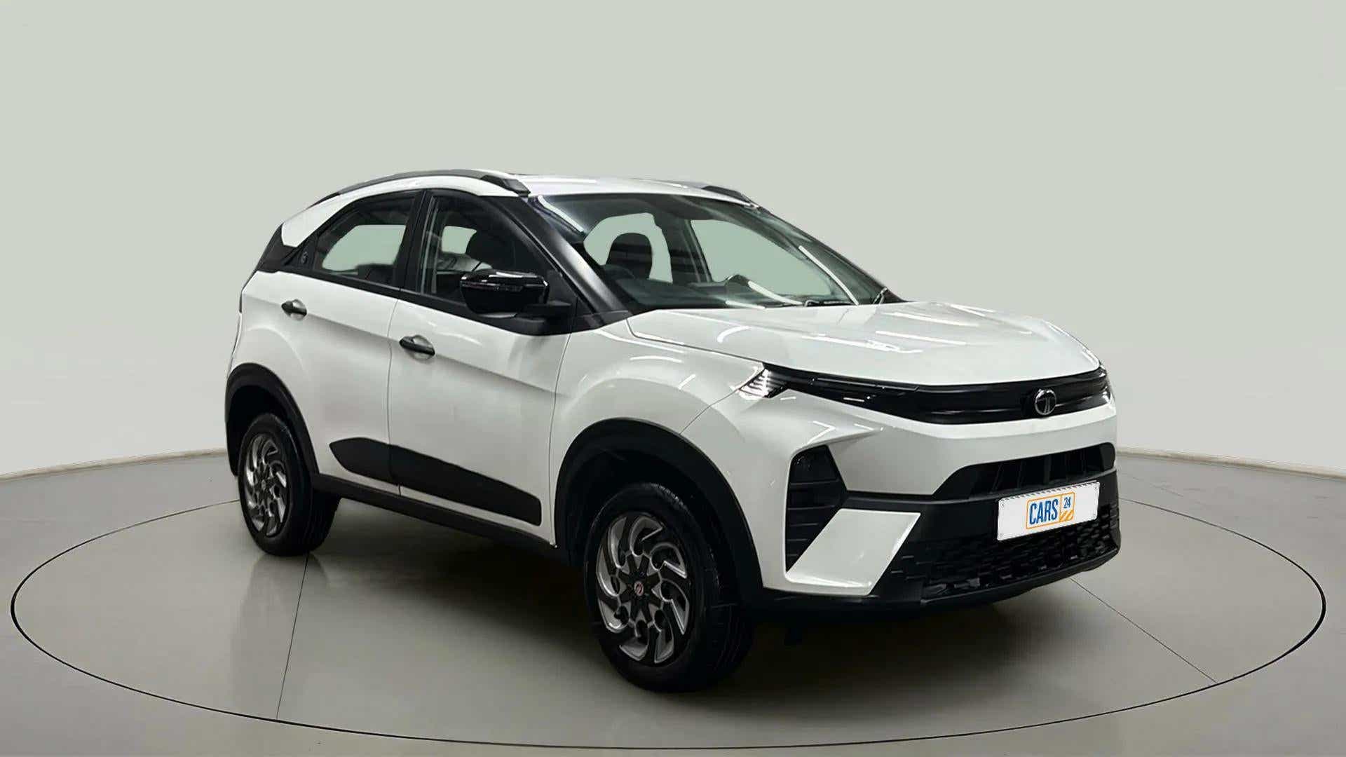 Front three-quarter view of a Calgary White Tata Nexon