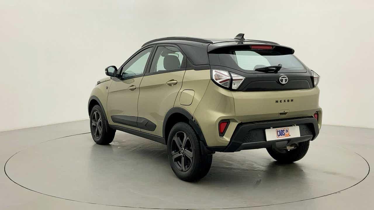 Rear three-quarter view of a Grassland Beige Tata Nexon 2017-2023