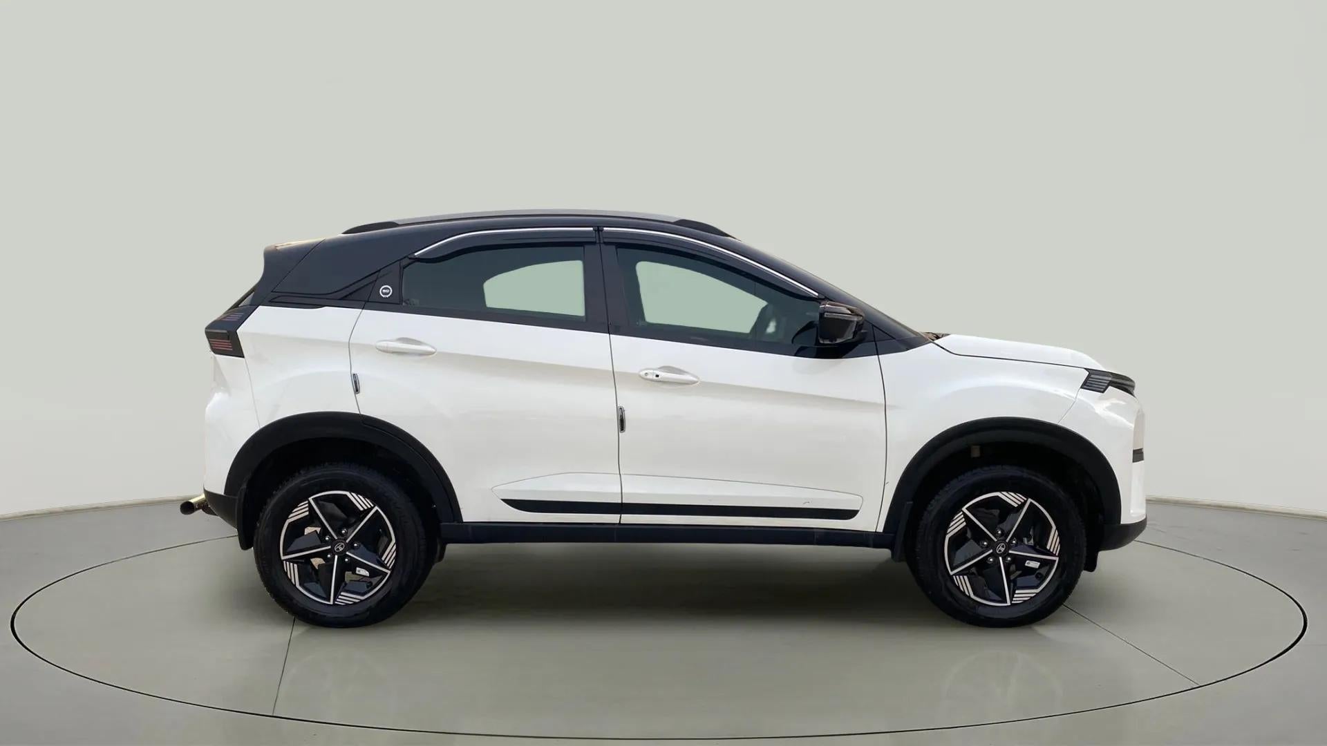 Side view of a Calgary White Tata Nexon 2017-2023