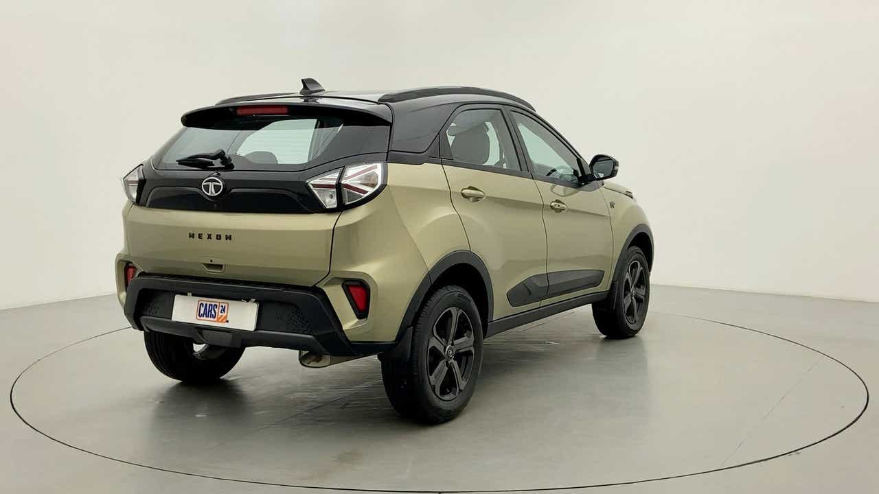 Rear three-quarter of a Grassland Beige Tata Nexon 2017-2023