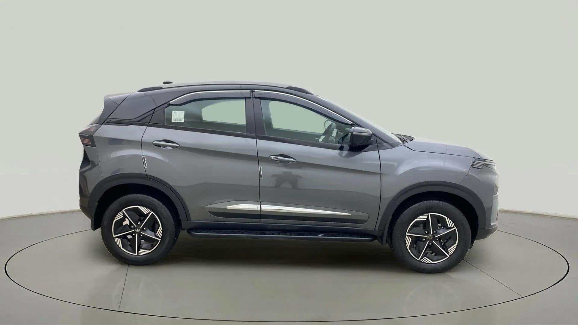 Side view of a daytona grey Tata Nexon