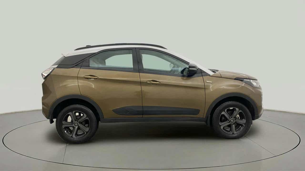 Side view of a Grassland Beige Tata Nexon 2017-2023