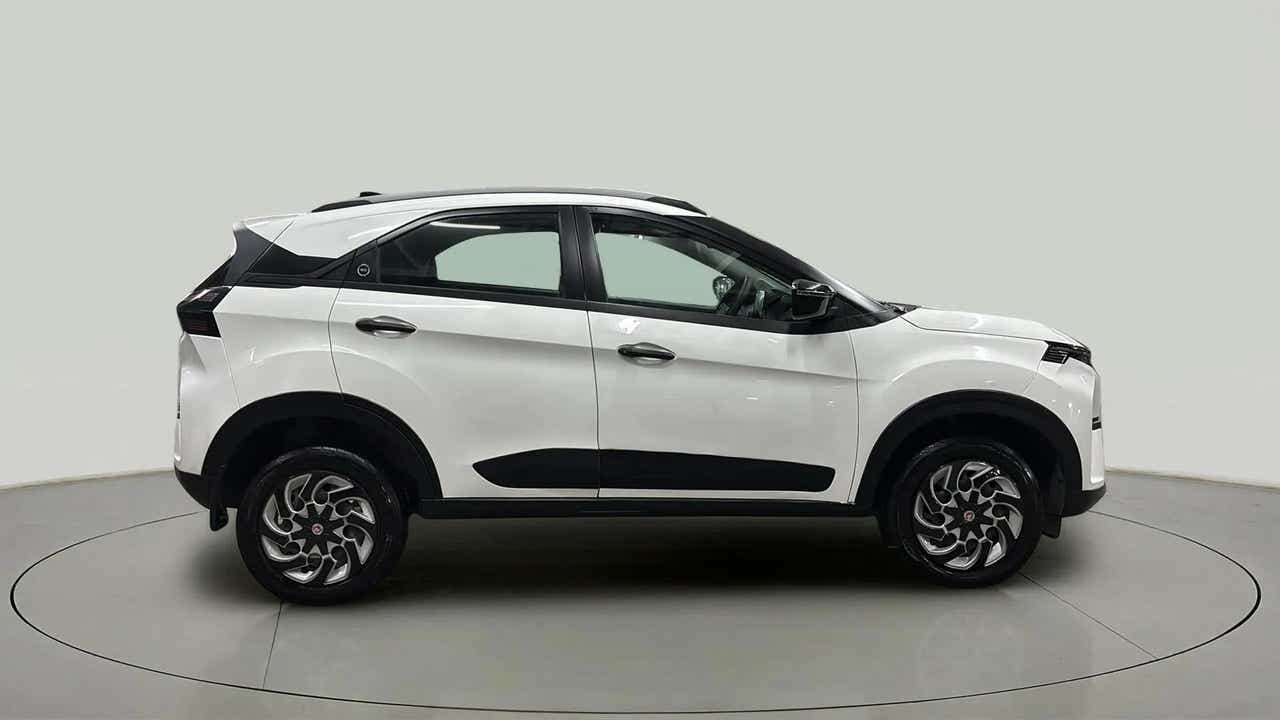 Side view of a Calgary White Tata Nexon