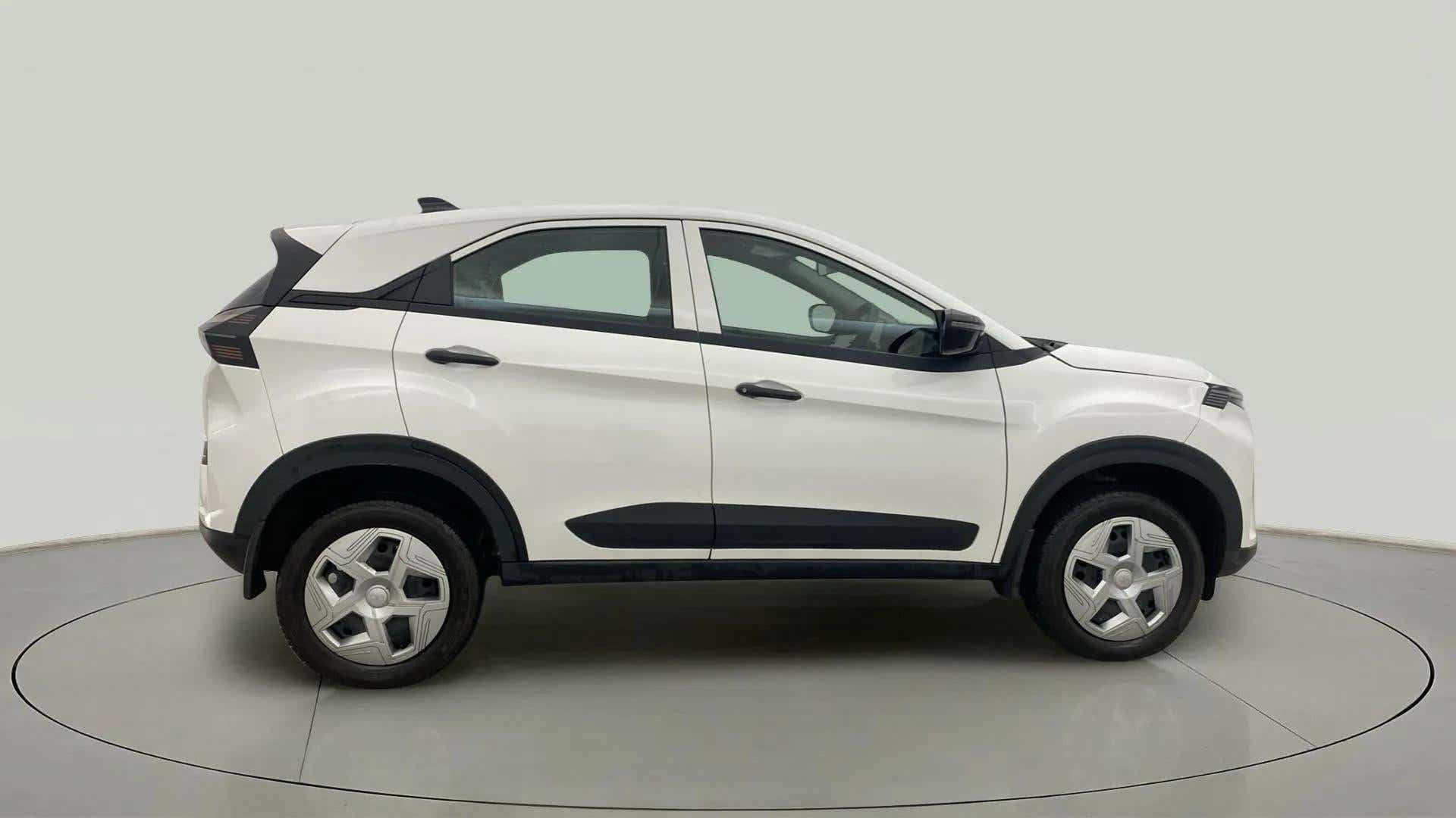 Side view of a Calgary White Tata Nexon