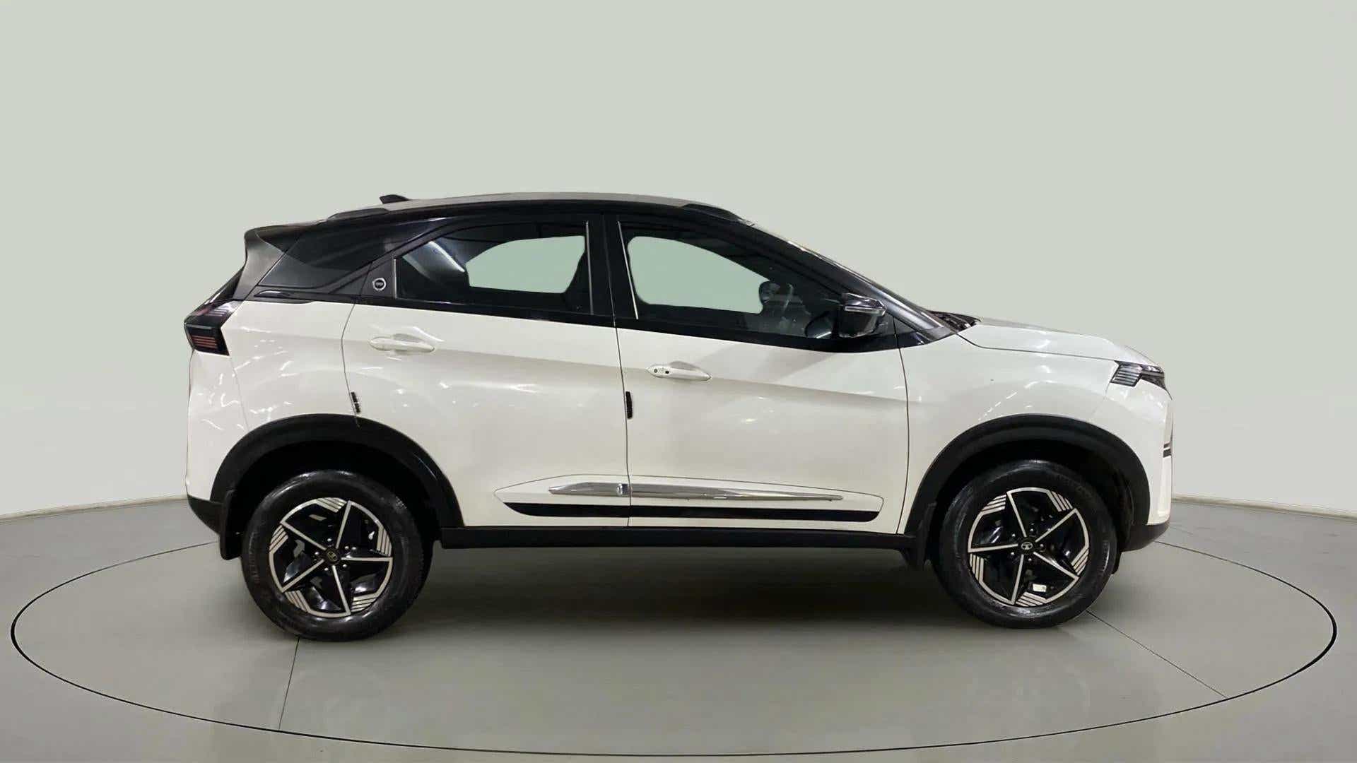 Side view of a Calgary White Tata Nexon 2017-2023
