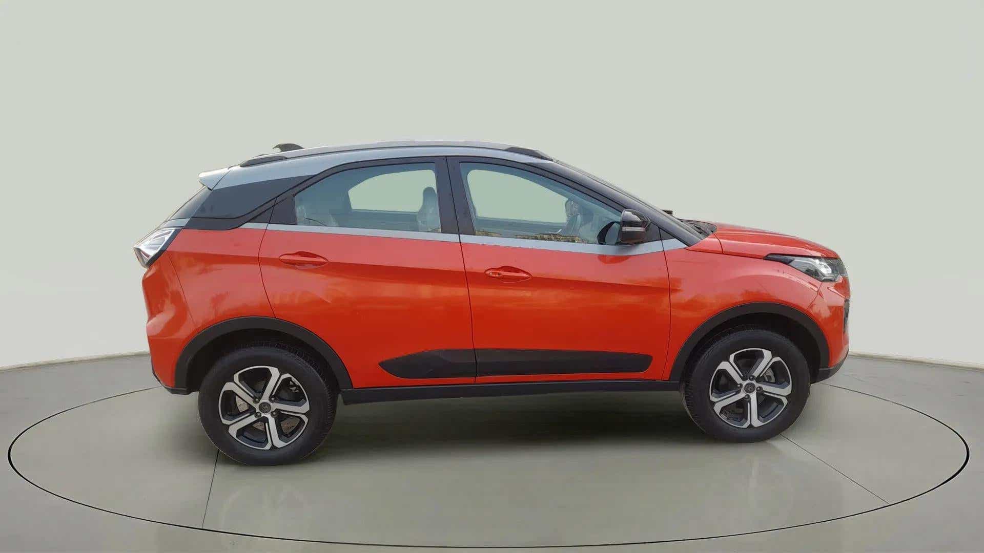 Side view of a Flame Red Tata Nexon 2017-2023