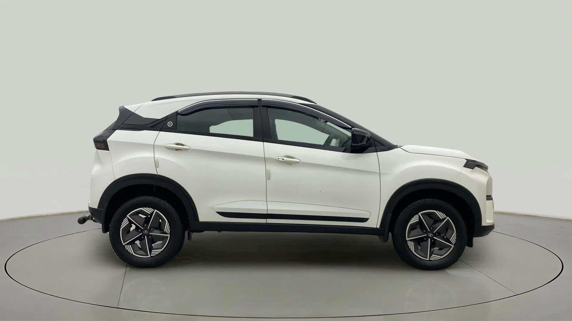 Side view of a Calgary White Tata Nexon 2017-2023