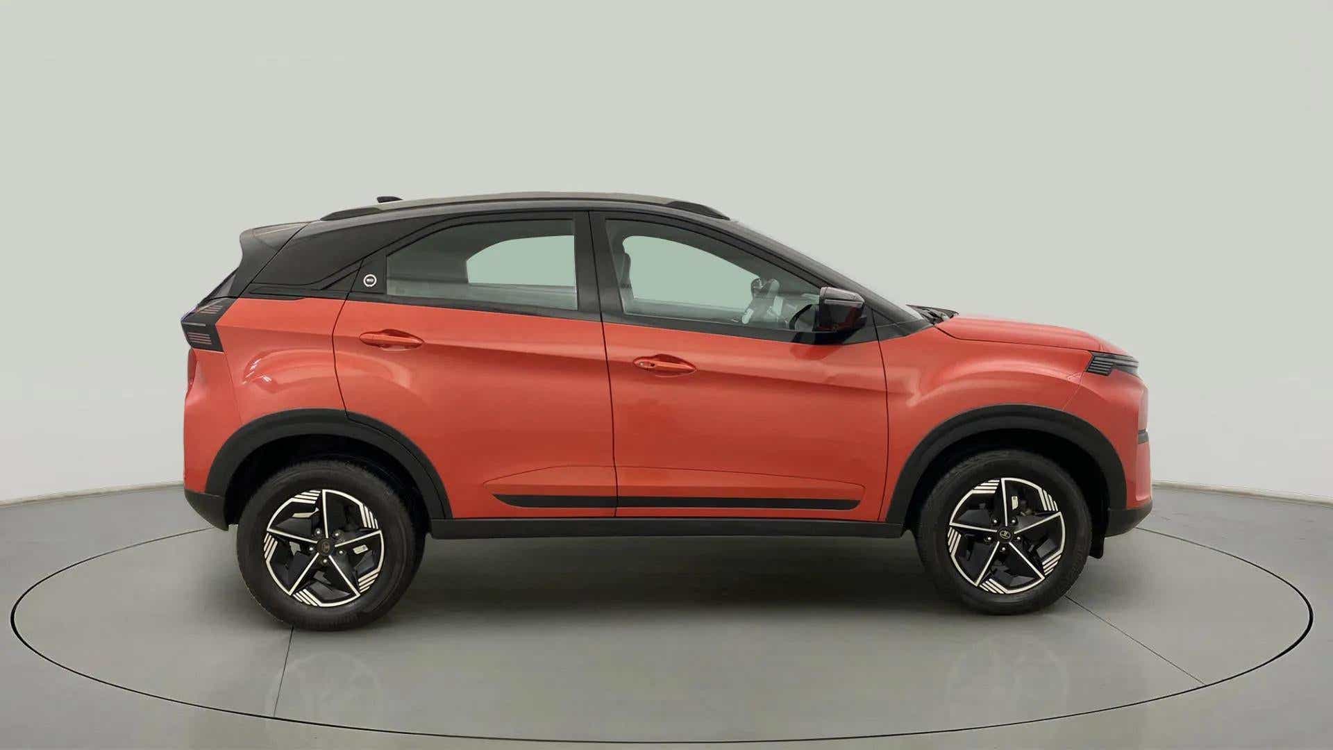 Side view of a Flame Red Tata Nexon 2017-2023