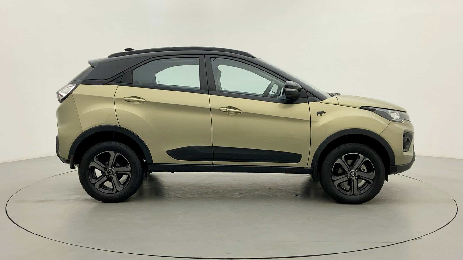 Side view of a Grassland Beige Tata Nexon 2017-2023