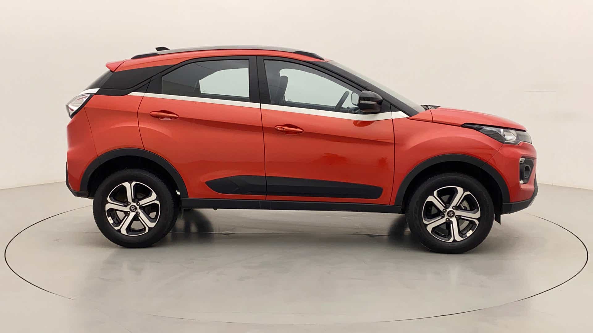 Side view of a Flame Red Tata Nexon 2017-2023