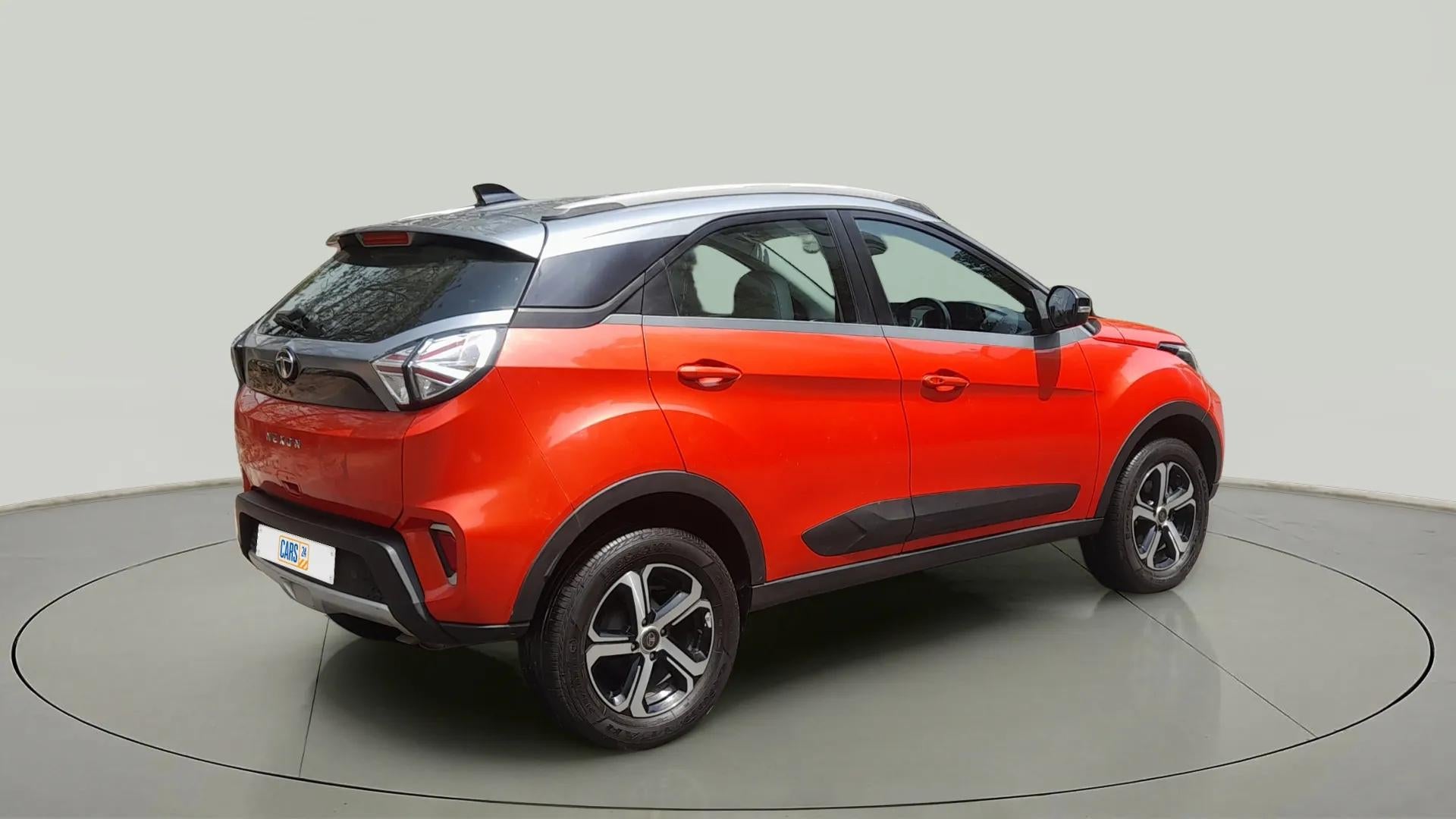 Rear three-quarter view of a Flame Red Tata Nexon 2017-2023