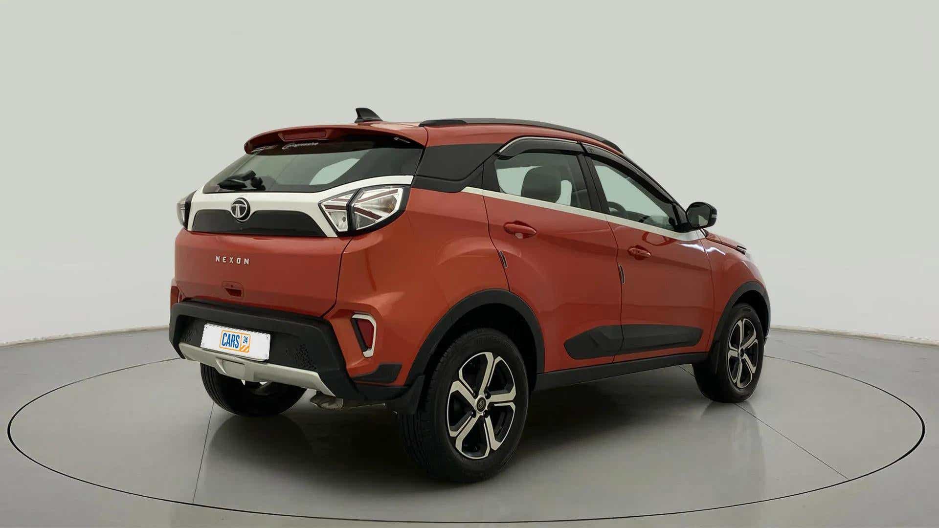 Rear three-quarter view of a Flame Red Tata Nexon 2017-2023