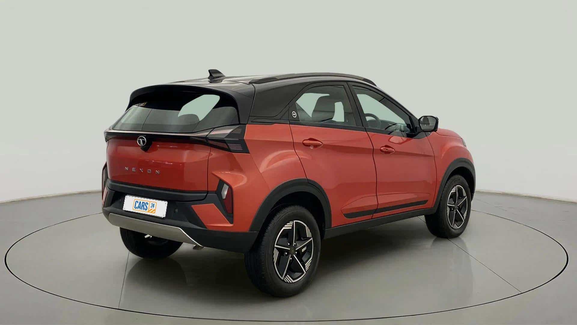 Rear three-quarter of a Flame Red Tata Nexon 2017-2023