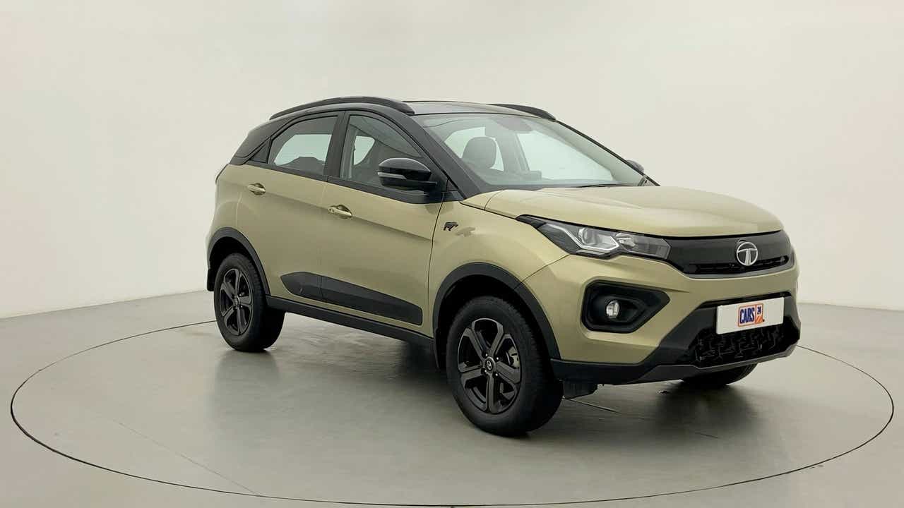 Front three-quarter view of a Grassland Beige Tata Nexon 2017-2023