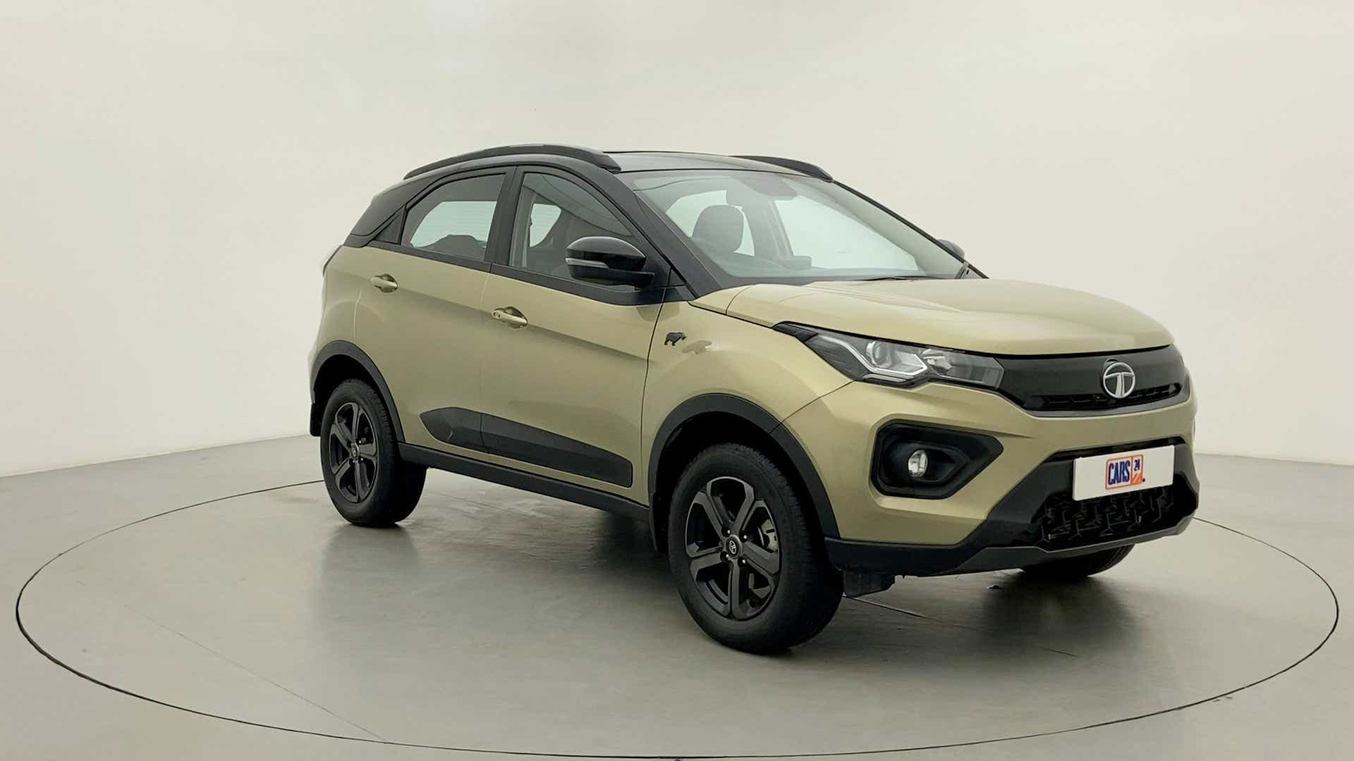 Front three-quarter view of a Grassland Beige Tata Nexon 2017-2023