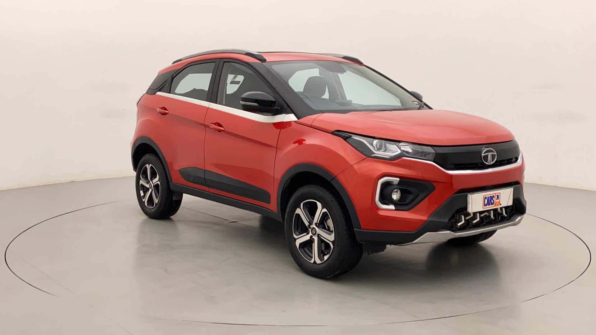 Front three-quarter view of a Flame Red Tata Nexon 2017-2023