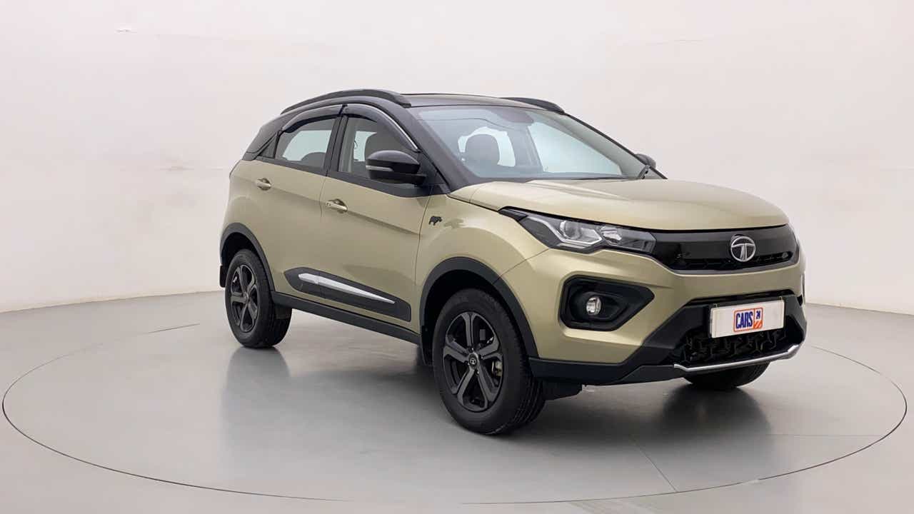Front three-quarter view of a Grassland Beige Tata Nexon 2017-2023