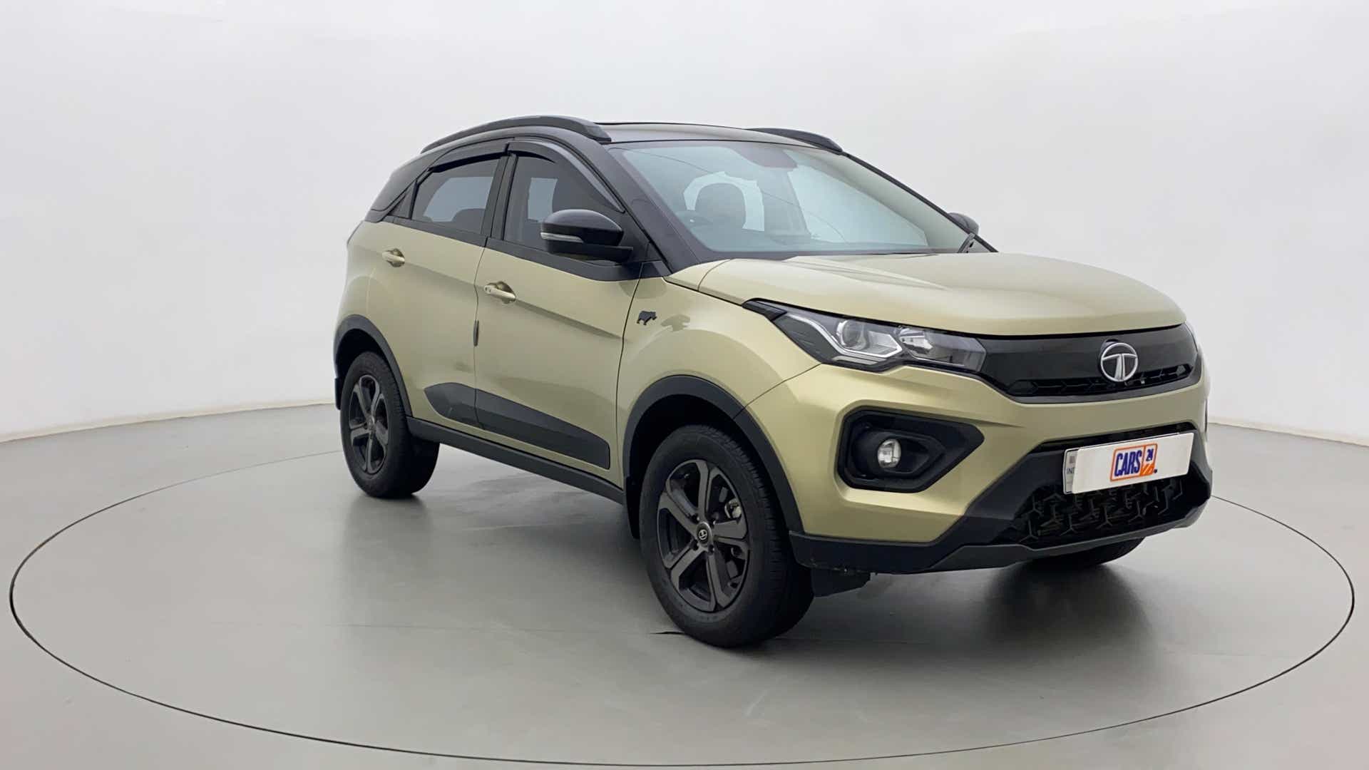 Front three-quarter view of a Grassland Beige Tata Nexon 2017-2023