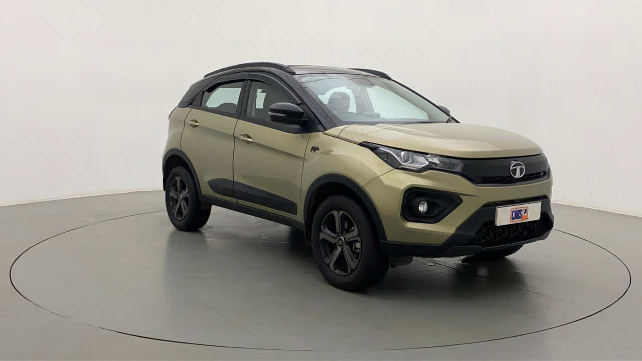Front three-quarter view of a Grassland Beige Tata Nexon 2017-2023