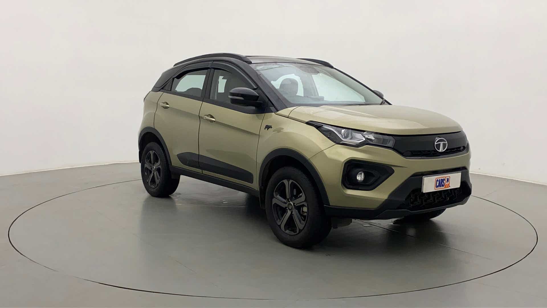Front three-quarter view of a Grassland Beige Tata Nexon 2017-2023