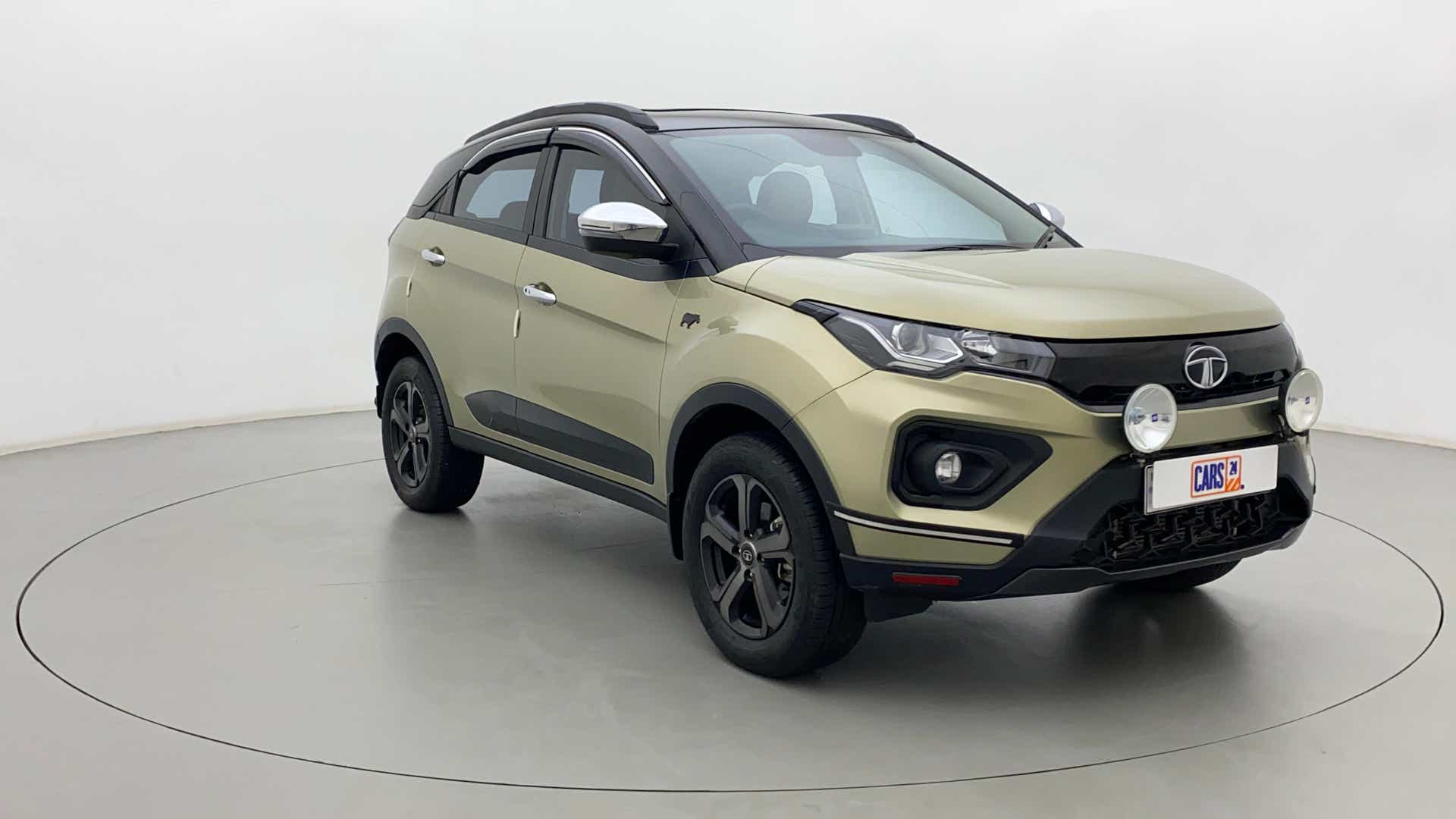Front three-quarter view of a Grassland Beige Tata Nexon 2017-2023